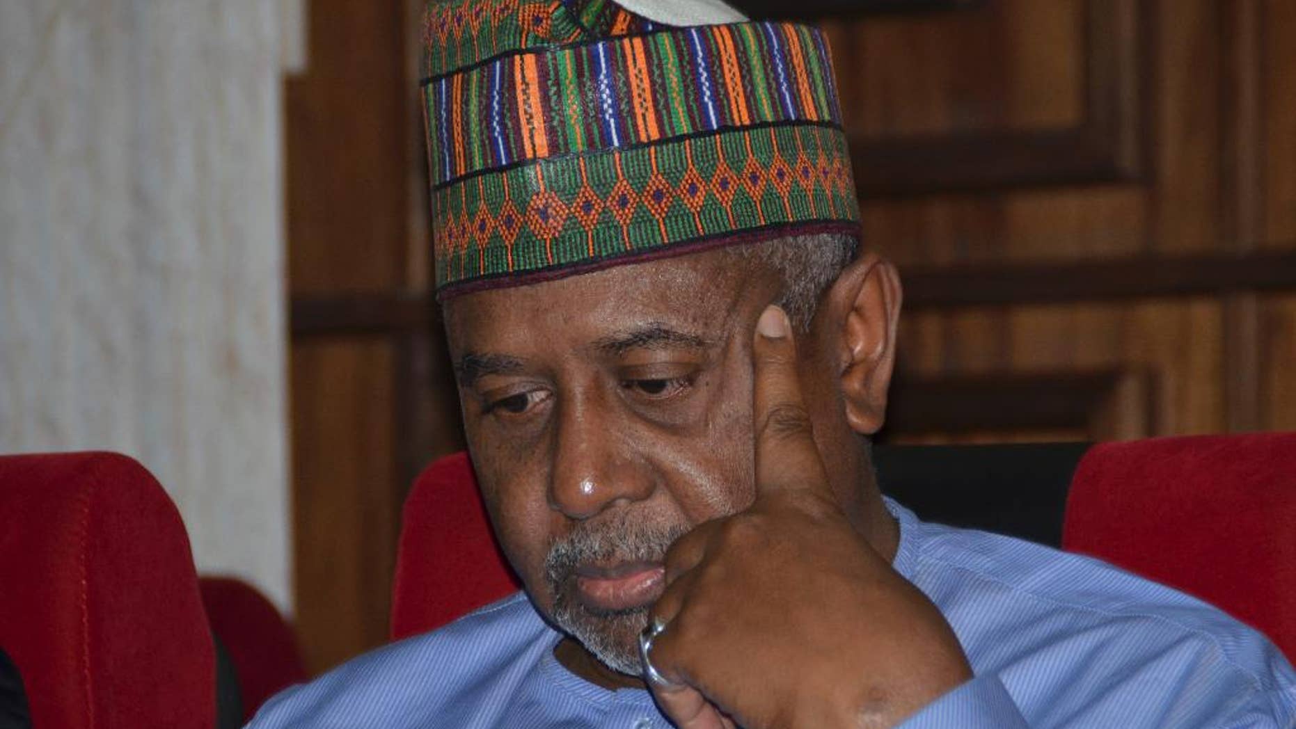 FILE- In this Tuesday, Sept.1, 2015 file photo, Nigeria's former national security adviser Sambo Dasuki attends a hearing to face charges of possessing weapons illegally, at the Federal High Court in Abuja, Nigeria. Nigeria’s former national security adviser pleaded not guilty to money laundering Monday in connection with $423,000 in U.S. dollars and Nigerian naira seized at his homes. (AP Photo file)