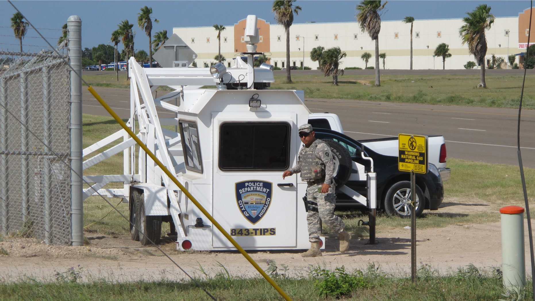 A Texas National Guardsman exits an observation tower in Hidalgo, Texas, on Thursday, Aug. 14, 2014. Several dozen soldiers deployed in the Rio Grande Valley are part of the up to 1,000 troops called up by Gov. Rick Perry last month, Texas National Guard Master Sgt. Ken Walker of the Joint Counterdrug Task Force said Thursday. (AP Photo/Christopher Sherman)