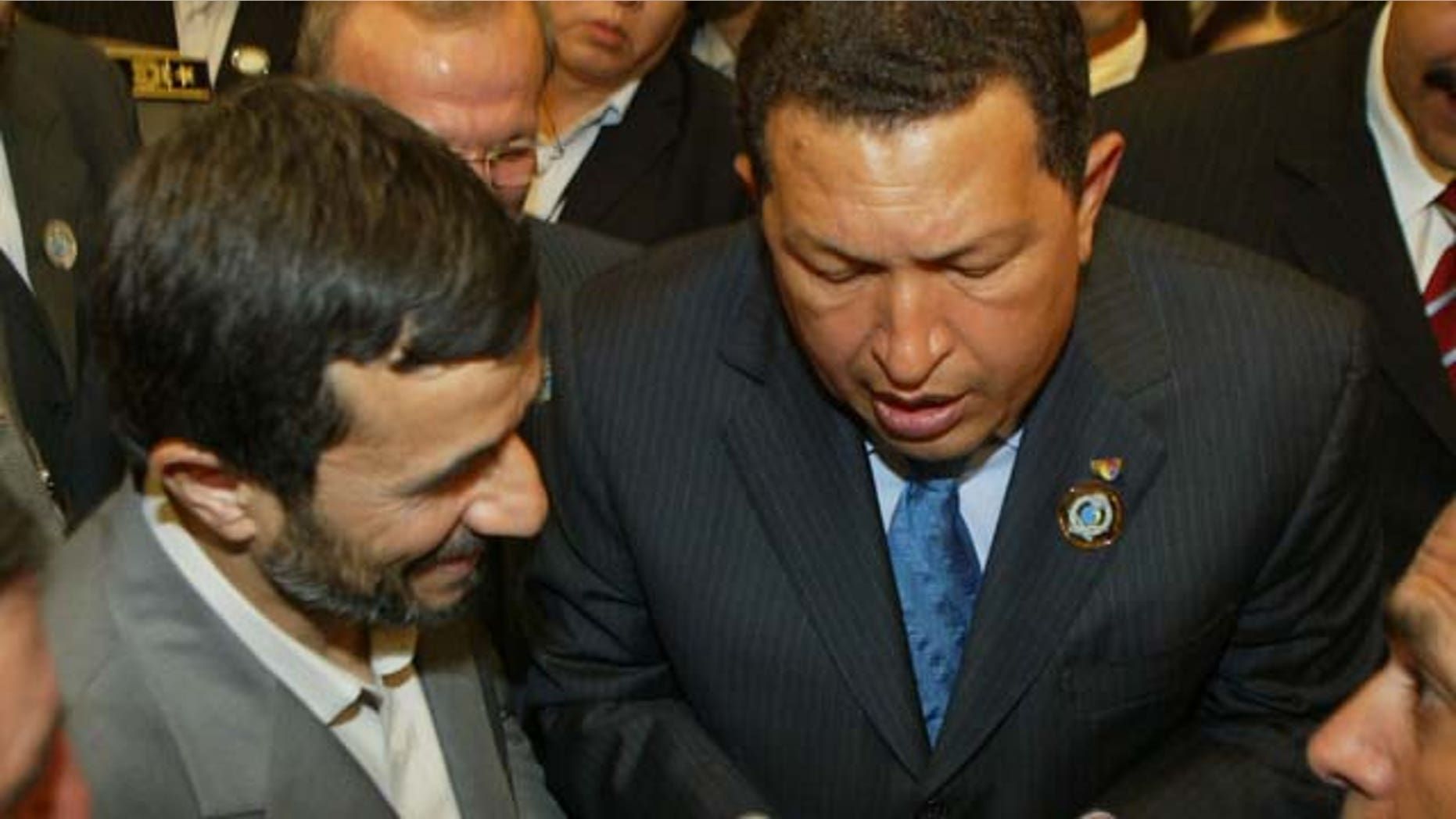 RIYADH, SAUDI ARABIA- NOVEMBER 18: Venezuelan President Hugo Chaves (R) talks to Iranian President Mahmoud Ahmadinejad (L) at the closing of the Third OPEC Summit , November 18, 2007 in Riyadh, Saudi Arabia. Iranian President Mahmoud Ahmadinejad has announced plans for discussions with Arab nations about plans to enrich uranium in a neutral country outside of the the Middle-Eastern region, such as Switzerland (Photo by Salah Malkawi/ Getty Images)