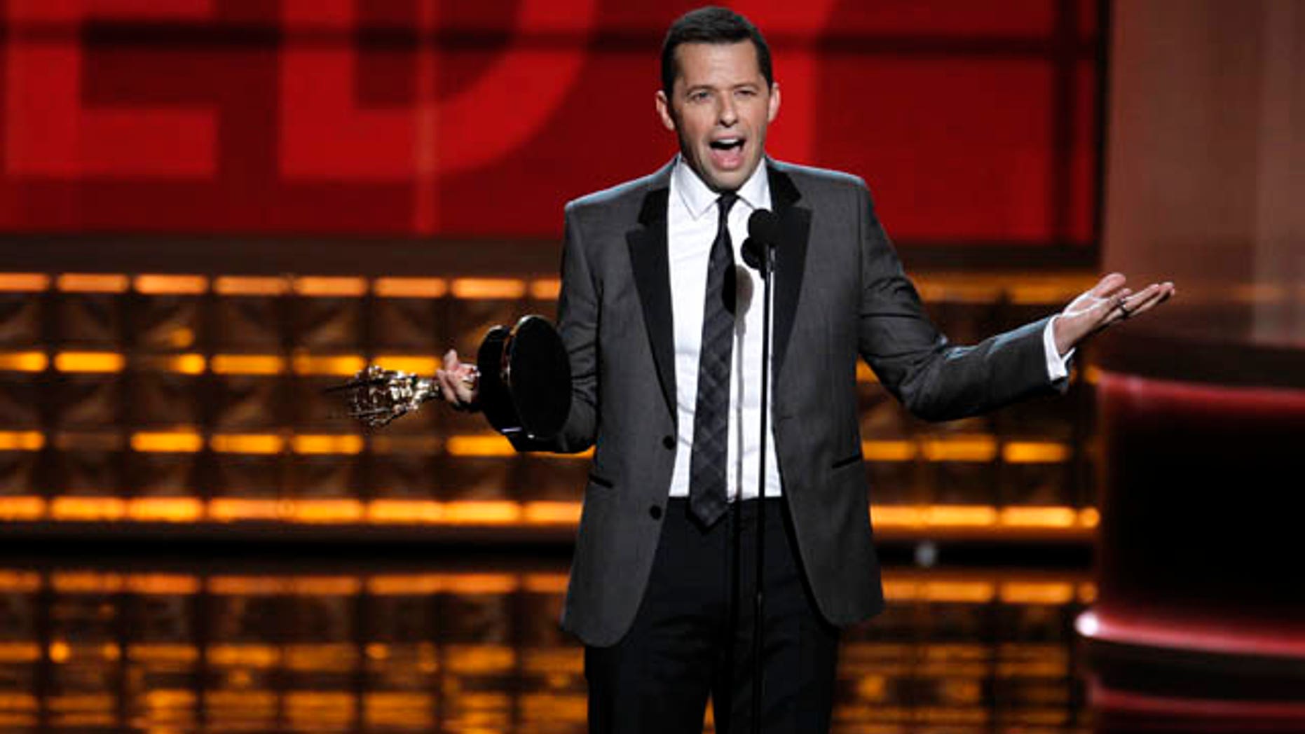Jon Cryer accepts the award for outstanding lead actor in a comedy series for his role in "Two and a Half Men" at the 64th Primetime Emmy Awards in Los Angeles, September 23, 2012. REUTERS/Lucy Nicholson (UNITED STATES - Tags: ENTERTAINMENT) (EMMYS-SHOW)