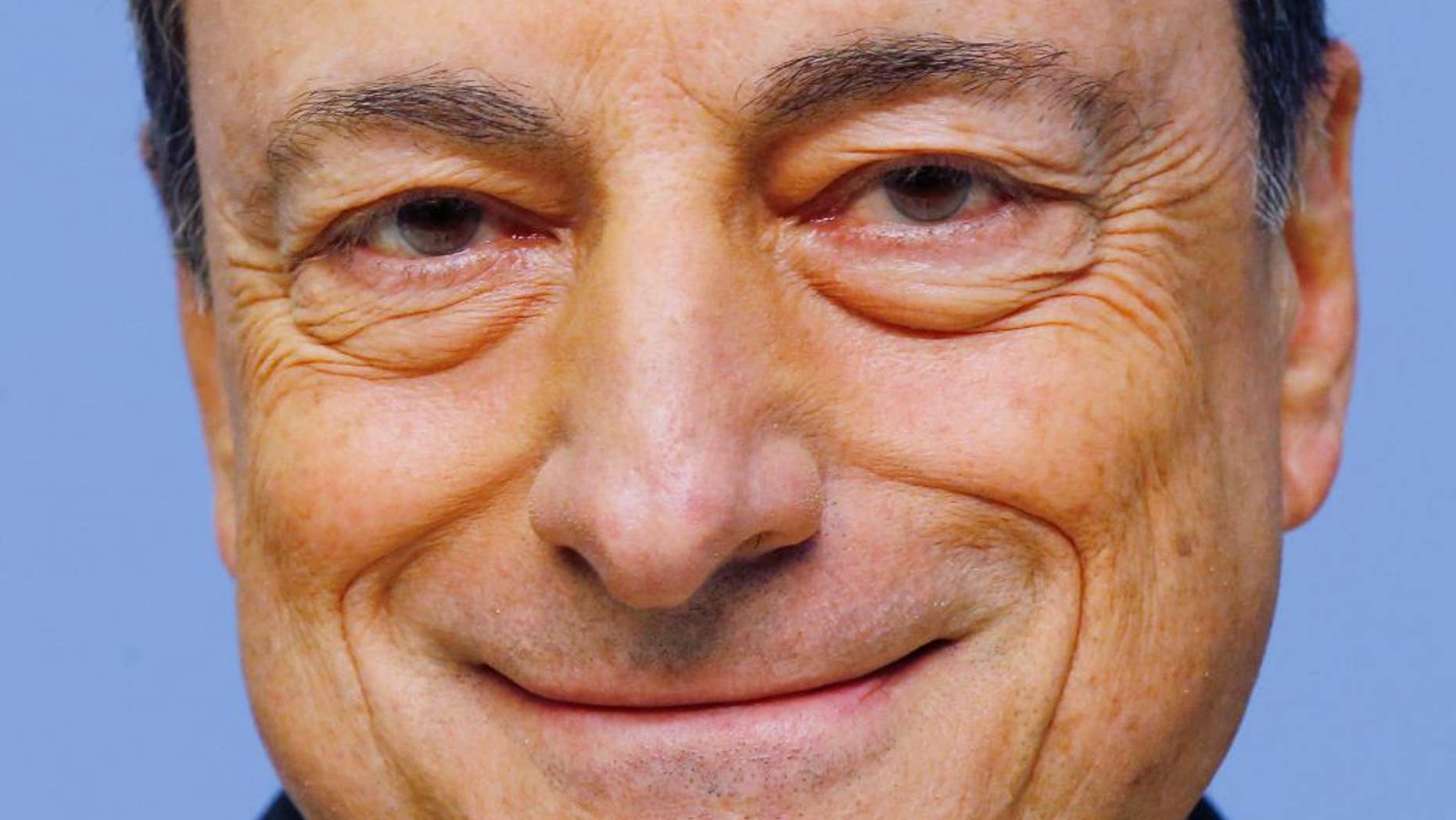 FILE - In this July 16, 2015 file picture the President of the European Central Bank, ECB, Mario Draghi smiles prior to a news conference following the meeting of the Governing Council of the ECB in Frankfurt, Germany. ECB head Mario Draghi has signaled clearly that action is coming this week when the bank's governing council meets On Thursday Dec. 3, 2015. (AP Photo/Michael Probst.File)