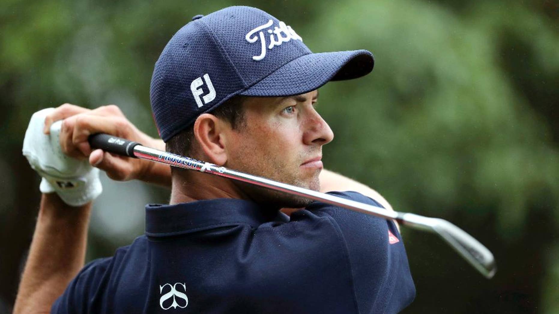 FILE - In this Oct. 27, 2016, file photo, Adam Scott of Australia hits the ball from a sand bank during the WGC-HSBC Champions golf tournament at the Sheshan International Golf Club in Shanghai, China. On Friday, Scott put together back-to-back rounds of 68 and feels like he's really back in the swing of things as he heads into the weekend at the Australian PGA Championship four shots off the pace. (AP Photo/Ng Han Guan, File)
