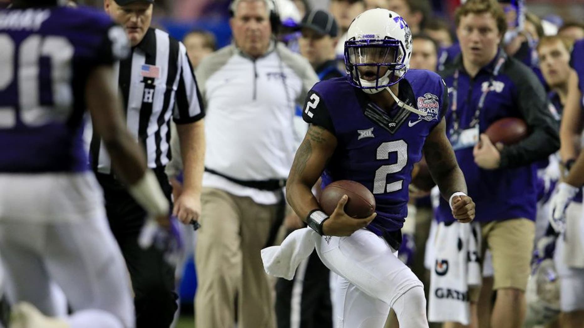 Dec 31, 2014; Atlanta , GA, USA; TCU Horned Frogs quarterback Trevone Boykin (2) runs the ball during the second quarter in the 2014 Peach Bowl against the Mississippi Rebels at the Georgia Dome. Mandatory Credit: Paul Abell/CFA Peach Bowl via USA TODAY Sports