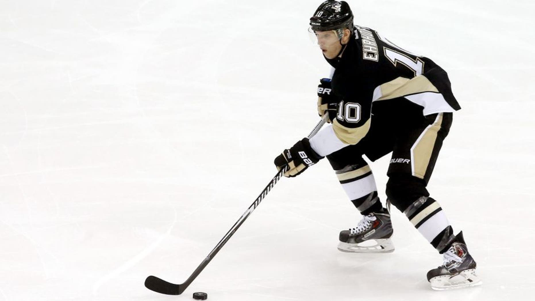 Dec 2, 2014; Pittsburgh, PA, USA; Pittsburgh Penguins defenseman Christian Ehrhoff (10) skates with the puck against the New Jersey Devils during the second period at the CONSOL Energy Center. The Penguins won 1-0. Mandatory Credit: Charles LeClaire-USA TODAY Sports