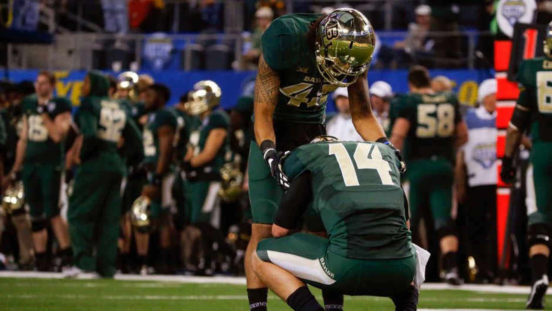 Jan 1, 2015; Arlington, TX, USA; Baylor Bears quarterback Bryce Petty (14) and wide receiver Levi Norwood (42) react during the game against the Michigan State Spartans in the 2015 Cotton Bowl Classic at AT&T Stadium. Mandatory Credit: Kevin Jairaj-USA TODAY Sports