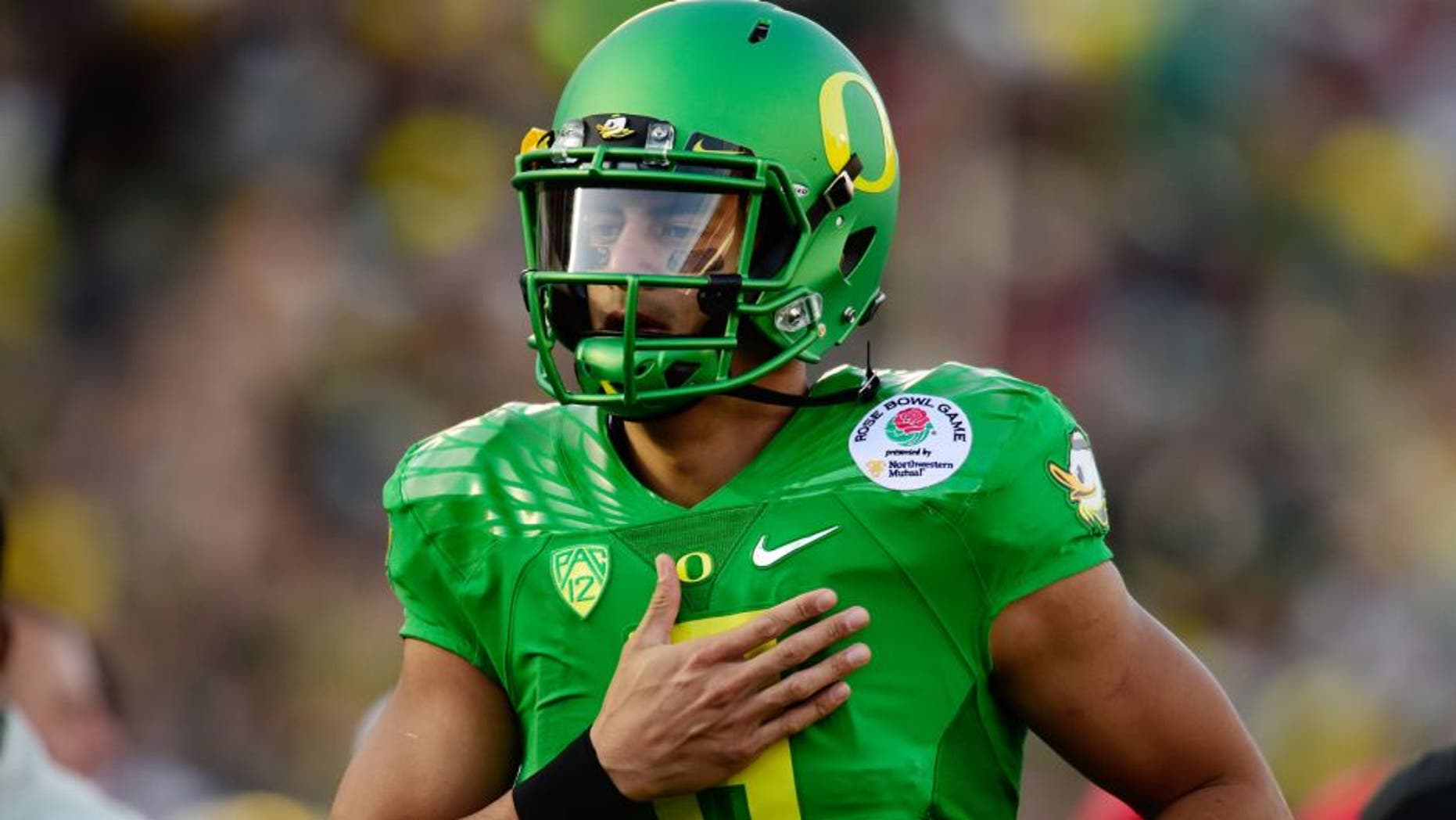 Jan 1, 2015; Pasadena, CA, USA; Oregon Ducks quarterback Marcus Mariota (8) runs off the field following the first half of the 2015 Rose Bowl college football game at Rose Bowl. Mandatory Credit: Robert Hanashiro-USA TODAY Sports