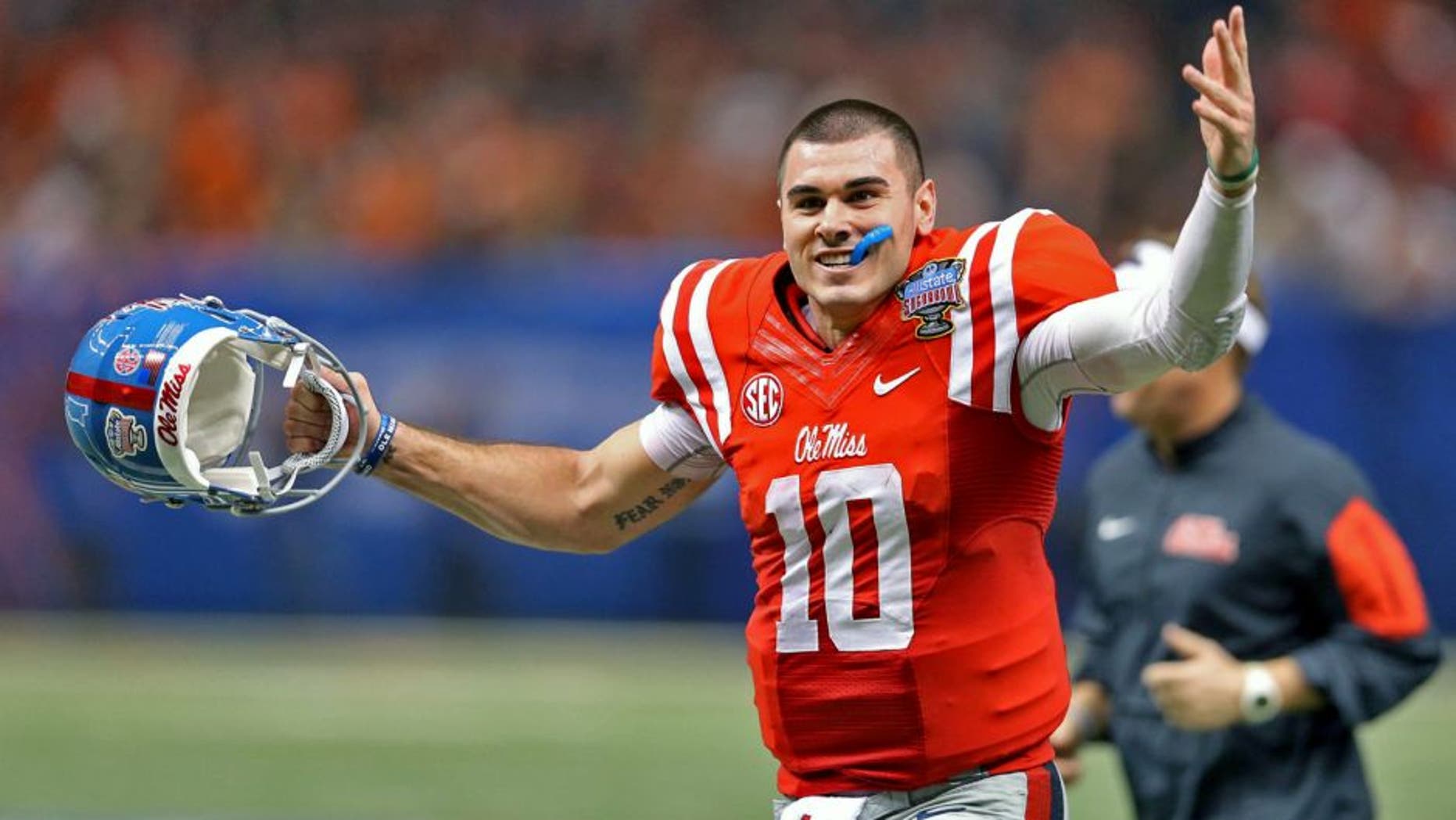 Jan 1, 2016; New Orleans, LA, USA; Mississippi Rebels quarterback Chad Kelly (10) gestures while running off the field at the end of the the second quarter against the Oklahoma State Cowboys in the 2016 Sugar Bowl at the Mercedes-Benz Superdome. Mandatory Credit: Chuck Cook-USA TODAY Sports