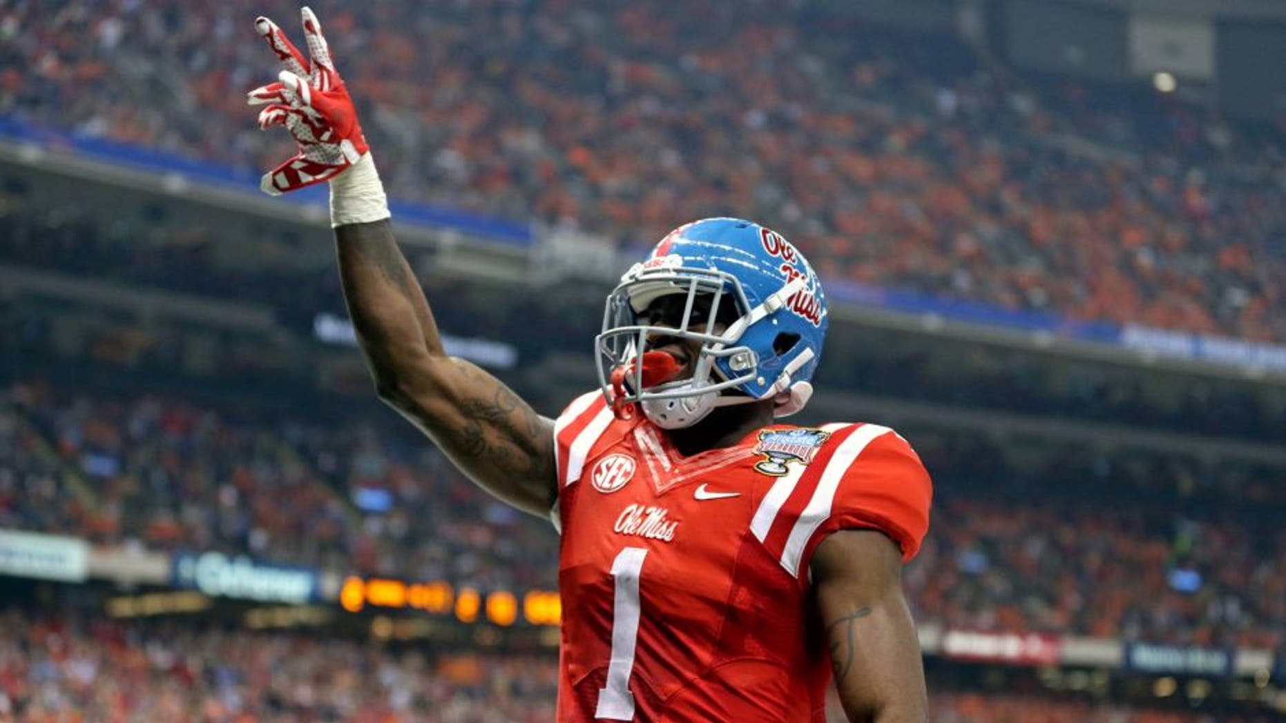 Jan 1, 2016; New Orleans, LA, USA; Mississippi Rebels wide receiver Laquon Treadwell (1) celebrates his ten-yard touchdown catch against the Oklahoma State Cowboys in the second quarter of the 2016 Sugar Bowl at the Mercedes-Benz Superdome. Mandatory Credit: Chuck Cook-USA TODAY Sports
