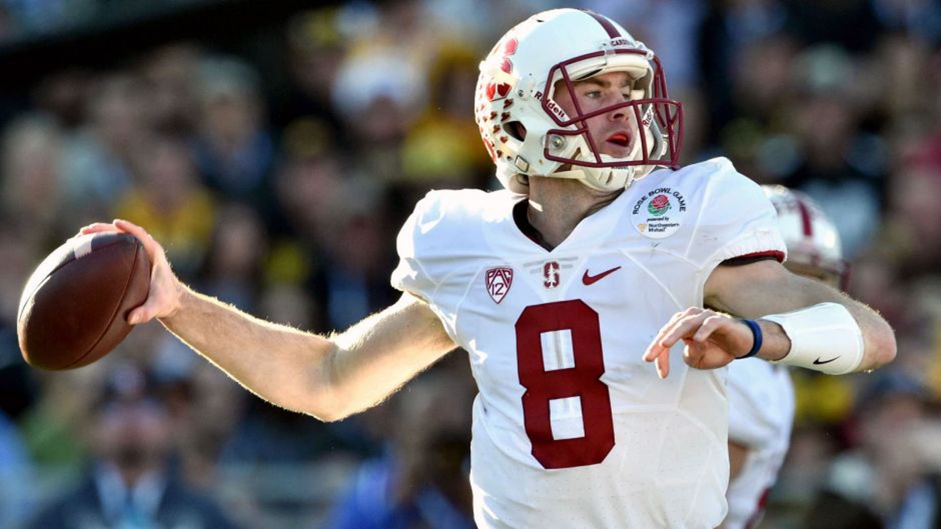 Jan 1, 2016; Pasadena, CA, USA; Stanford Cardinal quarterback Kevin Hogan (8) drops back to pass against the Iowa Hawkeyes during the second quarter in the 2016 Rose Bowl at Rose Bowl. Mandatory Credit: Kirby Lee-USA TODAY Sports