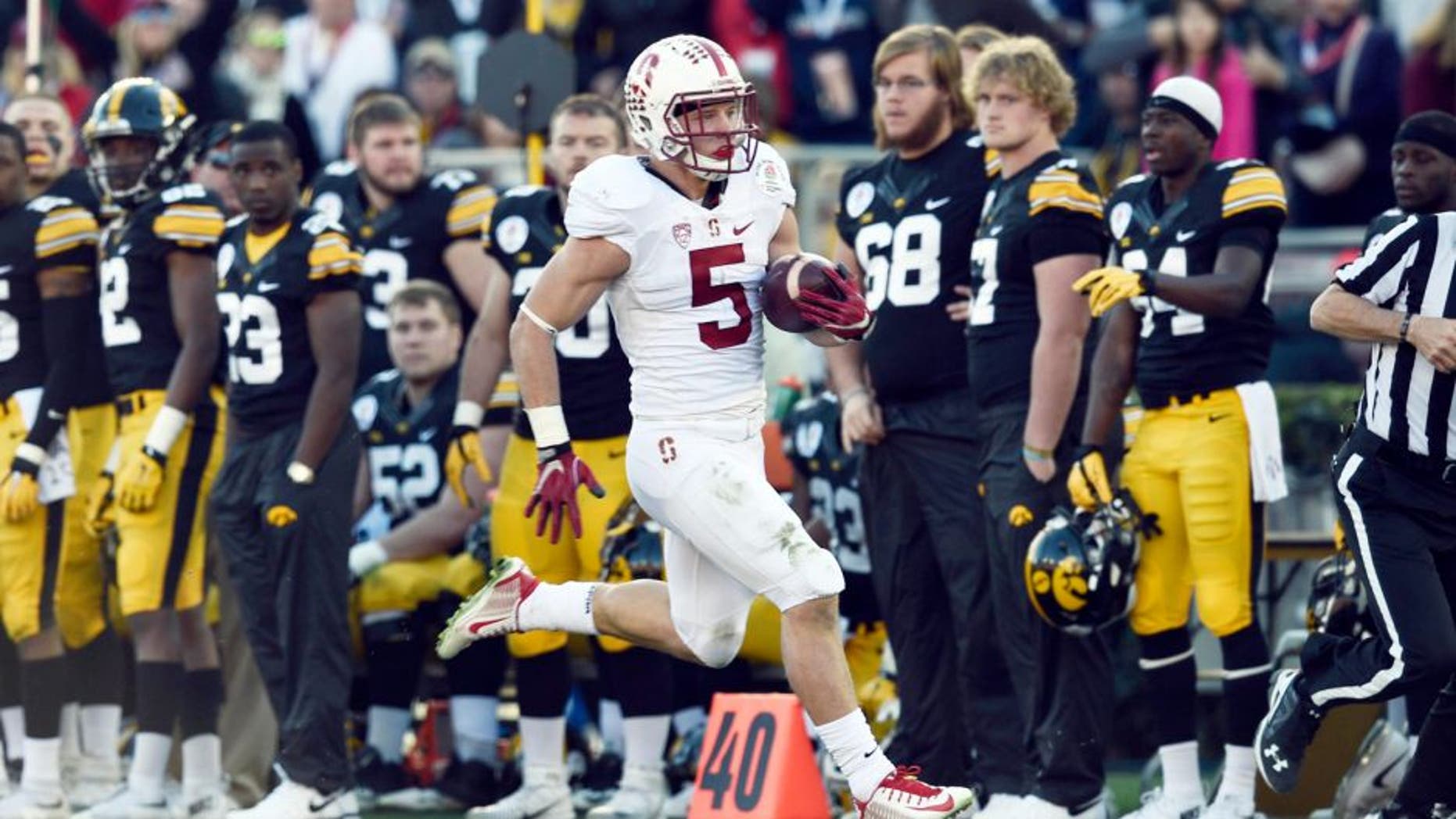 Jan 1, 2016; Pasadena, CA, USA; Stanford Cardinal running back Christian McCaffrey (5) runs against the Iowa Hawkeyes during the second quarter in the 2016 Rose Bowl at Rose Bowl. Mandatory Credit: Gary Vasquez-USA TODAY Sports