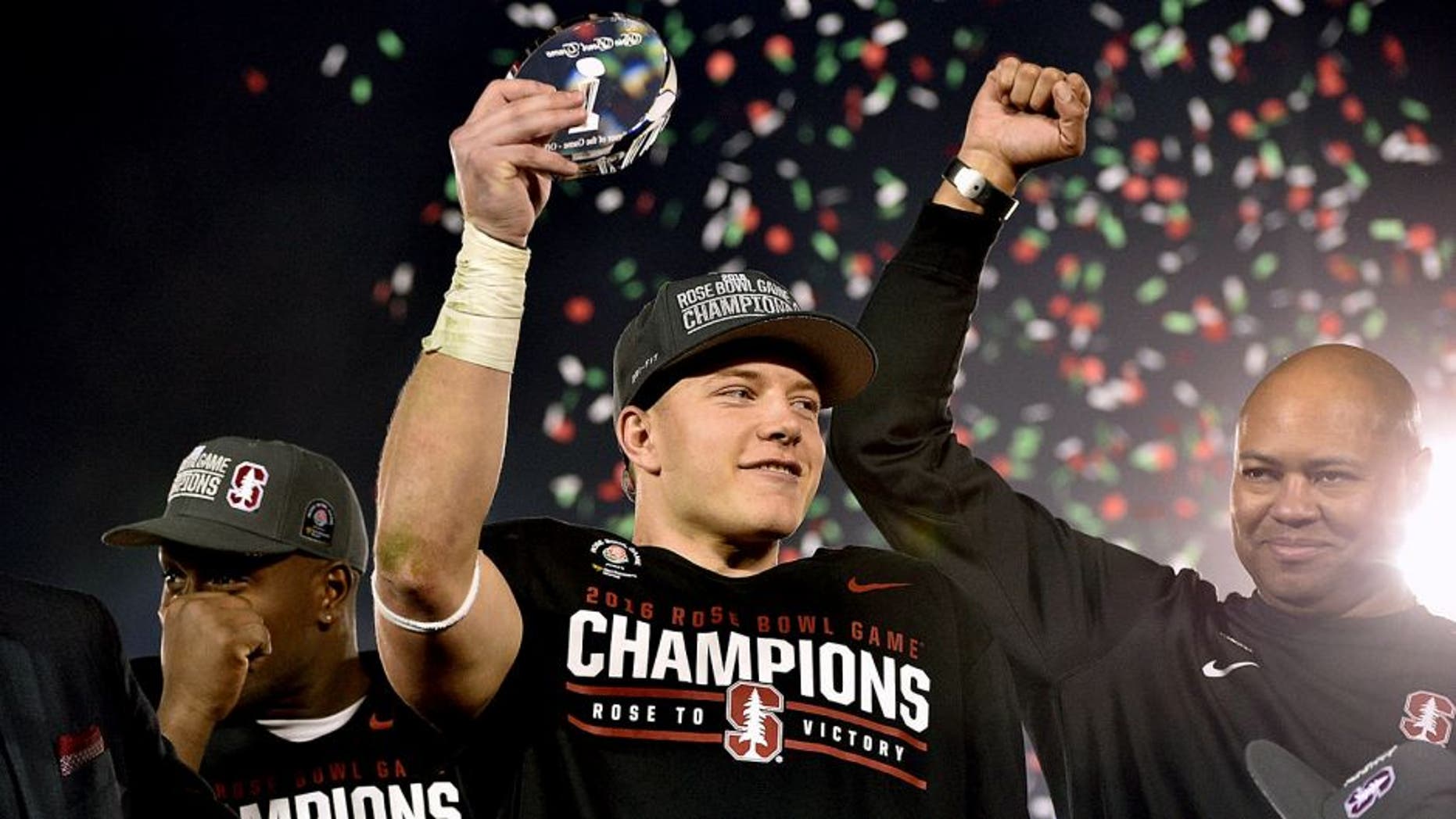 Jan 1, 2016; Pasadena, CA, USA; Stanford Cardinal running back Christian McCaffrey (5) celebrates with the Offensive Player of the Game Trophy after defeating the Iowa Hawkeyes in the 2016 Rose Bowl at Rose Bowl. Mandatory Credit: Robert Hanashiro-USA TODAY Sports