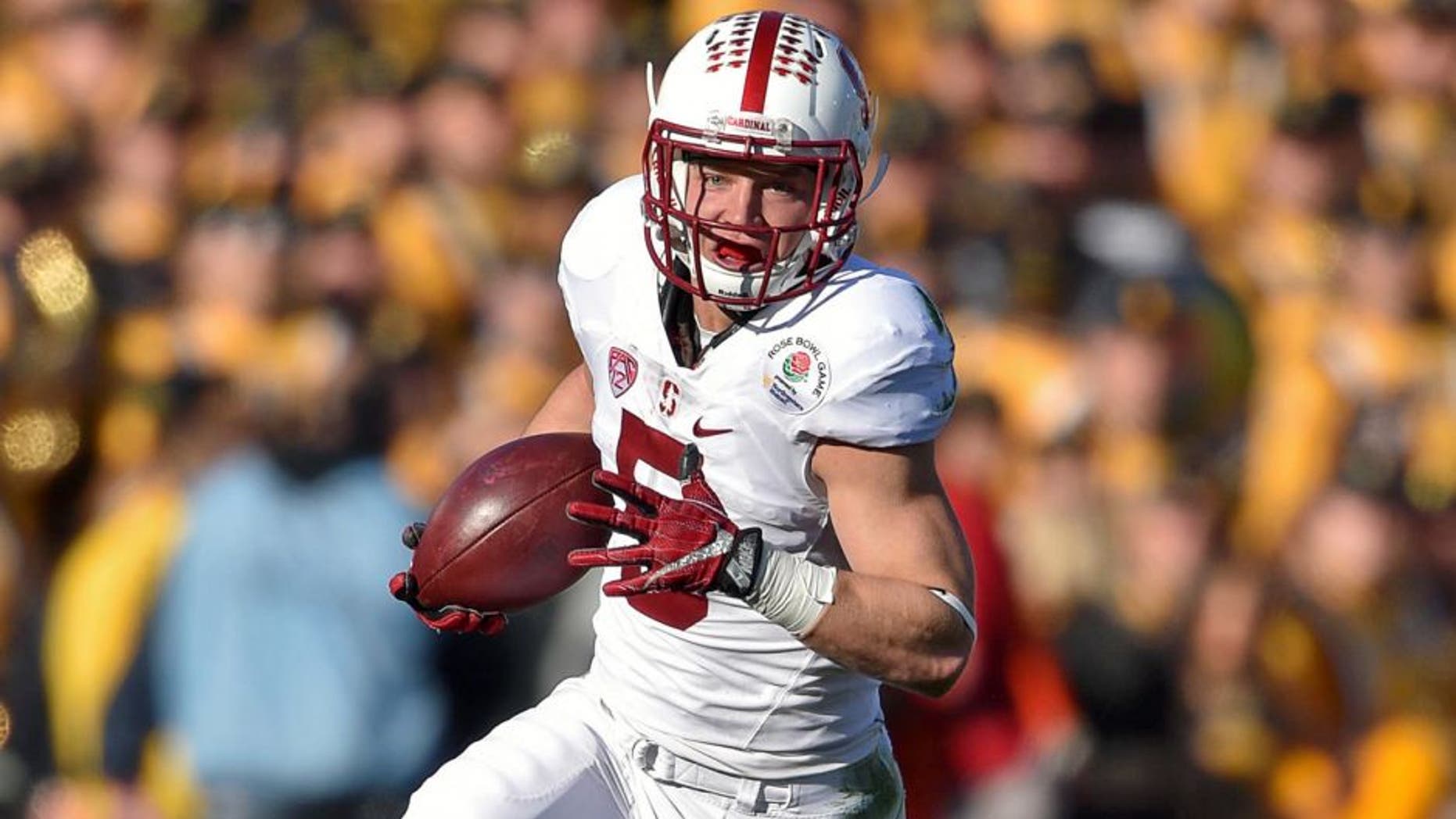 Jan 1, 2016; Pasadena, CA, USA; Stanford Cardinal running back Christian McCaffrey (5) runs against the Iowa Hawkeyes during the first quarter in the 2016 Rose Bowl at Rose Bowl. Mandatory Credit: Kirby Lee-USA TODAY Sports