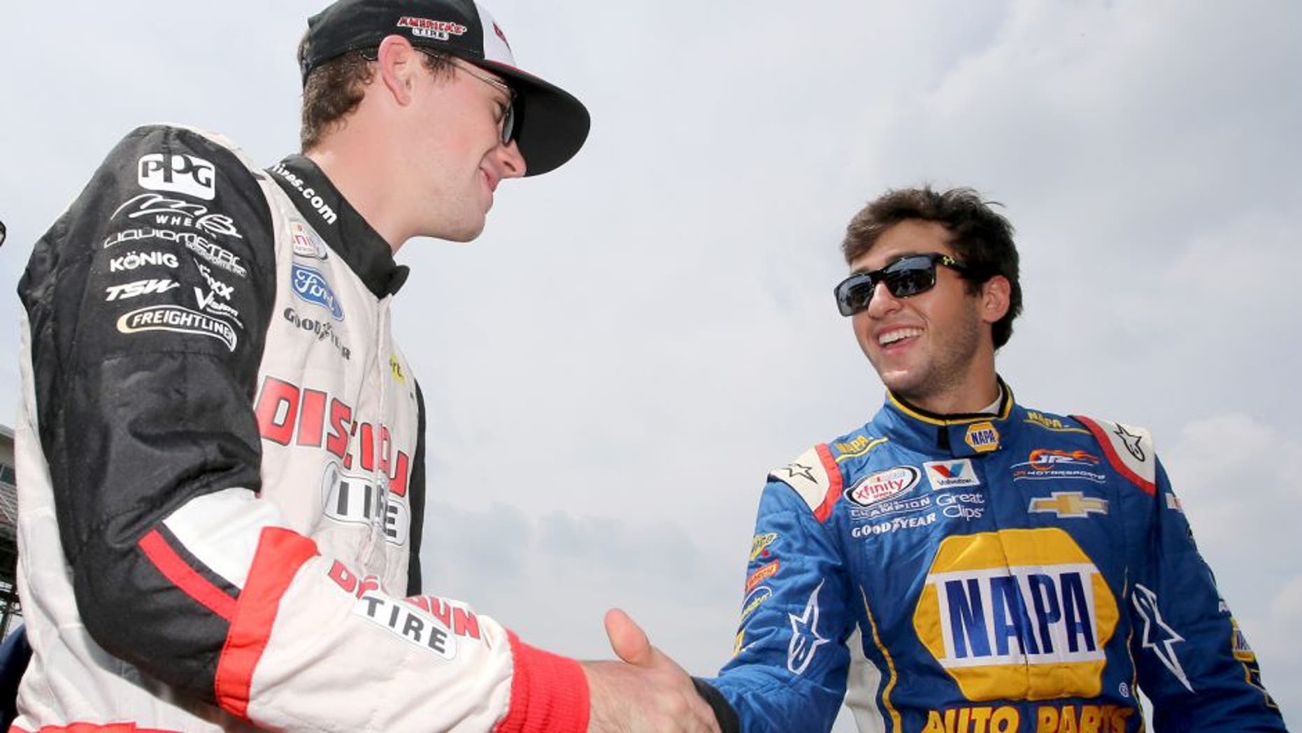 INDIANAPOLIS, IN - JULY 25: Ryan Blaney, driver of the #22 Discount Tire Ford, and Chase Elliott, driver of the #9 NAPA Auto Parts Chevrolet, speak on the grid prior to the NASCAR XFINITY Series Lilly Diabetes 250 at Indianapolis Motor Speedway on July 25, 2015 in Indianapolis, Indiana. (Photo by Brian Lawdermilk/Getty Images)