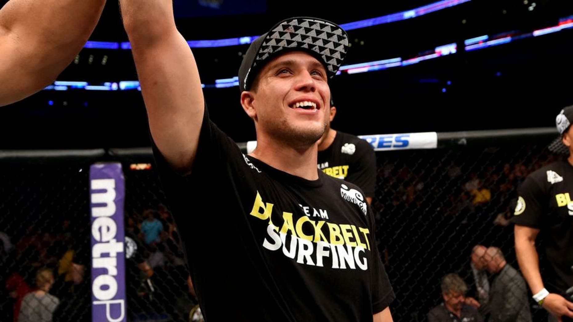 NEW ORLEANS, LA - JUNE 06: Brian Ortega celebrates his victory over Thiago Tavares in their featherweight bout during the UFC event at the Smoothie King Center on June 6, 2015 in New Orleans, Louisiana. (Photo by Josh Hedges/Zuffa LLC/Zuffa LLC via Getty Images)