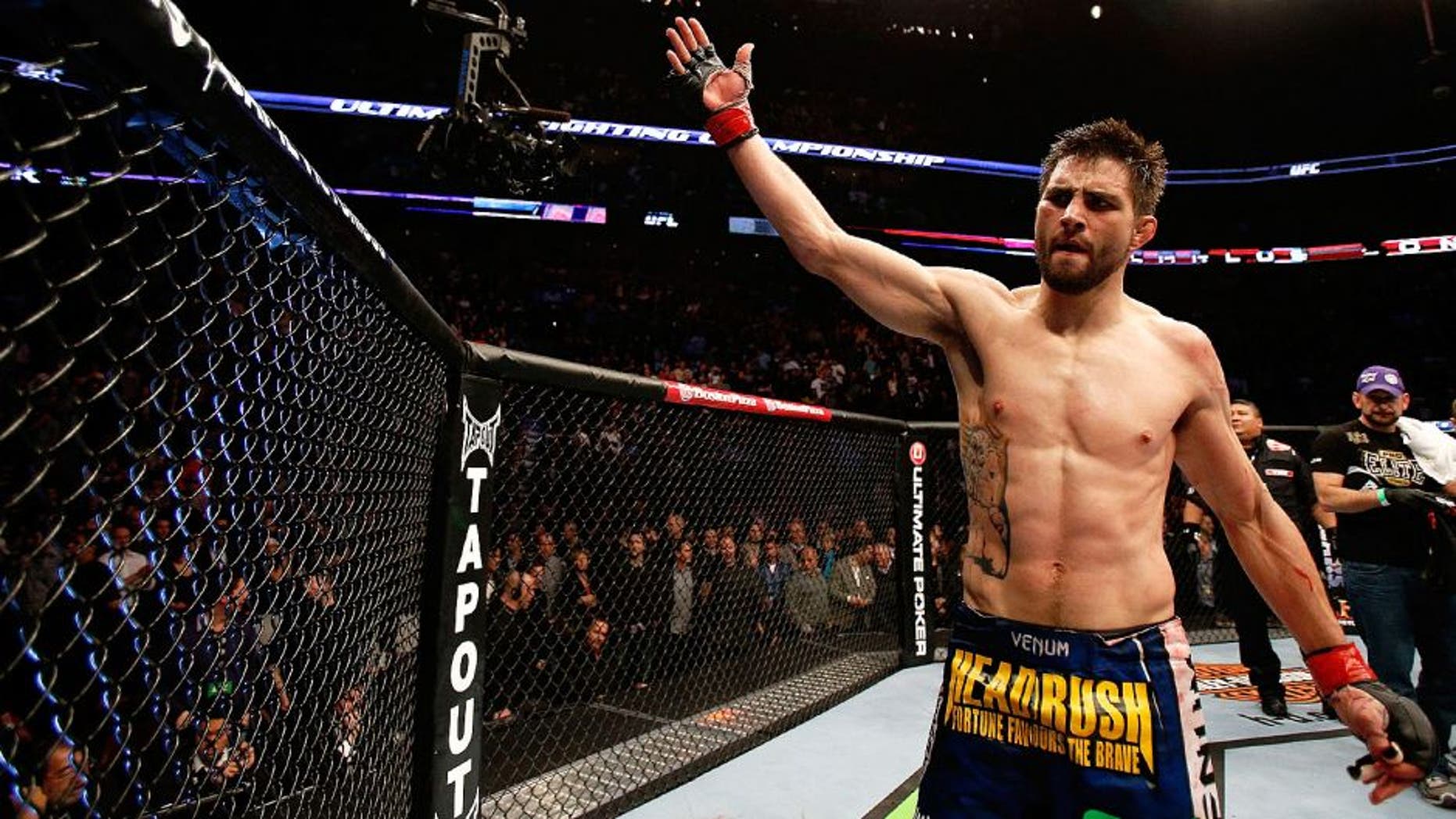 MONTREAL, QC - MARCH 16: Carlos Condit salutes the crowd after his three round battle against Johny Hendricks during the UFC 158 event at Bell Centre on March 16, 2013 in Montreal, Quebec, Canada. (Photo by Josh Hedges/Zuffa LLC/Zuffa LLC via Getty Images)