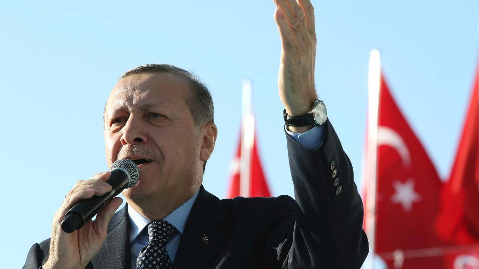 Turkey's President Recep Tayyip Erdogan addresses a rally in Sanliurfa, Turkey, Friday, Jan. 6, 2017. Turkey's justice minister Bekir Bozdag says police have detained 18 people in connection with a foiled attack at courthouse in the western city of Izmir that nevertheless killed a policeman and a courthouse employee. Addressing crowds in Sanliurfa, near the border with Syria, Erdogan reiterated claims that unidentified forces wanting to forestall Turkey's rise were behind such attacks. (Yasin Bulbul/Presidential Press Service, Pool photo via AP)