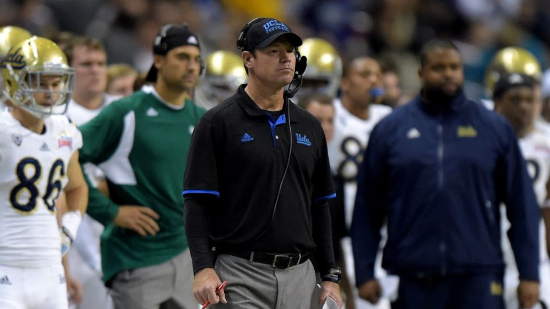 Jan 2, 2015; San Antonio, TX, USA; UCLA Bruins coach Jim Mora watches on the sidelines against the Kansas State Wildcats in the 2015 Alamo Bowl at Alamodome. UCLA defeated Kansas State 40-35. Mandatory Credit: Kirby Lee-USA TODAY Sports