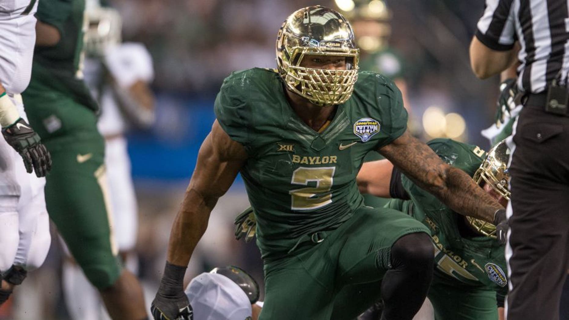 Jan 1, 2015; Arlington, TX, USA; Baylor Bears defensive end Shawn Oakman (2) celebrates his sack of Michigan State Spartans quarterback Connor Cook (18) during the first half in the 2015 Cotton Bowl Classic at AT&T Stadium. Mandatory Credit: Jerome Miron-USA TODAY Sports