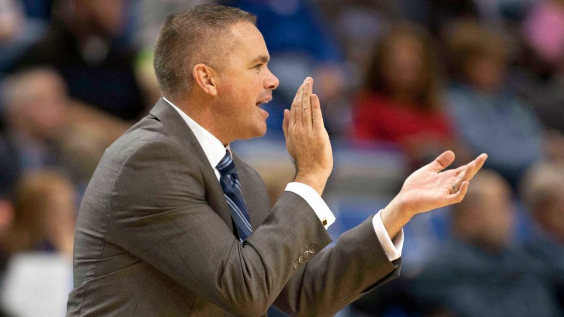 Dec 3, 2014; Terre Haute, IN, USA; Butler Bulldogs head coach Chris Holtmann applauds his team from the sideline in the second half of the game against the Indiana State Sycamores at Hulman Center. Butler won 77-54. Mandatory Credit: Trevor Ruszkowski-USA TODAY Sports