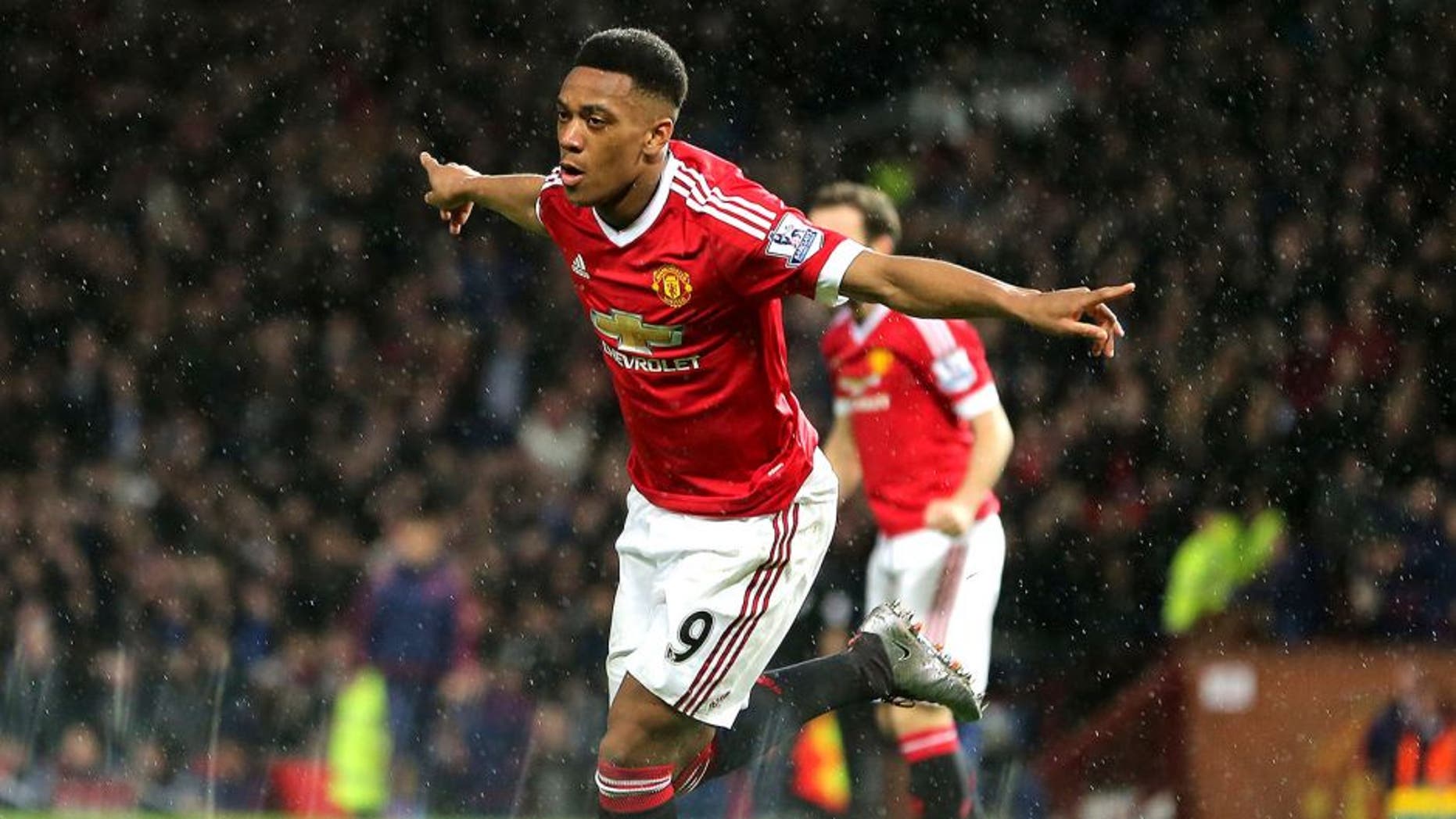 MANCHESTER, ENGLAND - JANUARY 02: Anthony Martial of Manchester United celebrates after scoring a goal to make it 1-0 during the Barclays Premier League match between Manchester United and Swansea City at Old Trafford on January 2, 2016 in Manchester, England. (Photo by James Baylis - AMA/Getty Images)