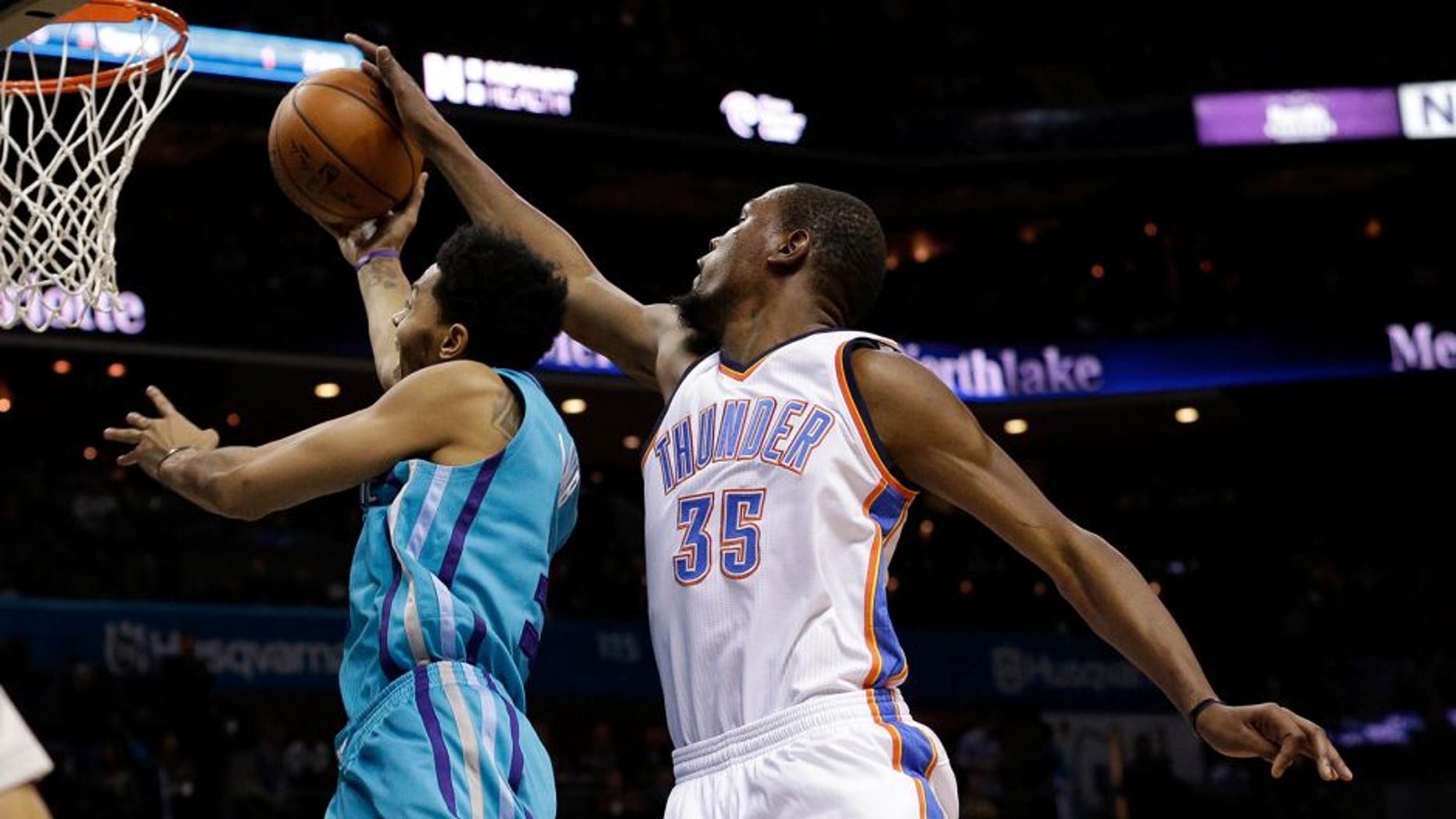 Jan 2, 2016; Charlotte, NC, USA; Oklahoma City Thunder forward Kevin Durant (35) blocks the shot of Charlotte Hornets guard Jeremy Lamb (3) from behind in the second half at Time Warner Cable Arena. The Thunder defeated the Hornets 109-90. Mandatory Credit: Jeremy Brevard-USA TODAY Sports