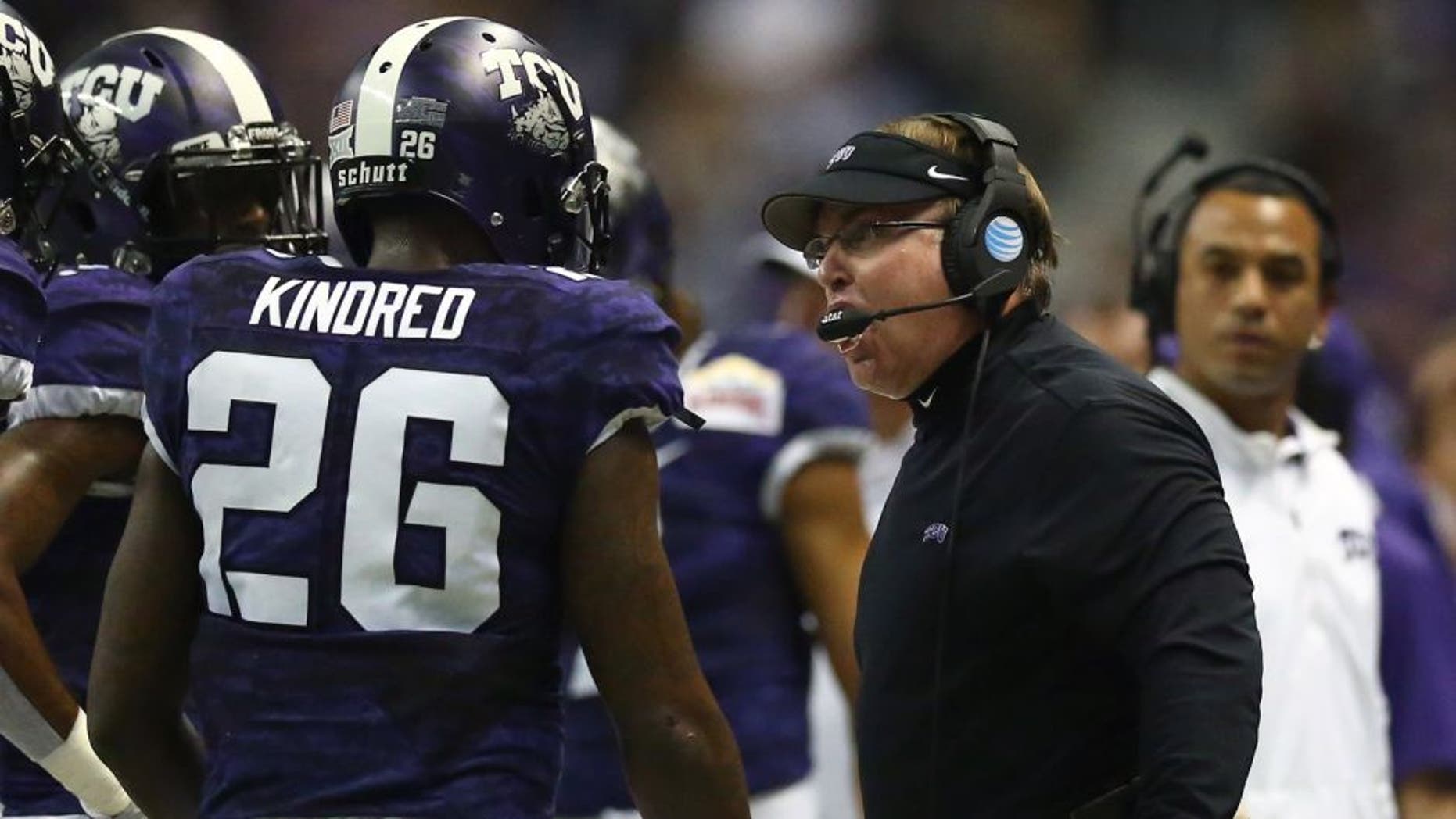 SAN ANTONIO, TX - JANUARY 02: Head coach Gary Patterson of the TCU Horned Frogs talks with Derrick Kindred #26 during the Valero Alamo Bowl at Alamodome on January 2, 2016 in San Antonio, Texas. (Photo by Ronald Martinez/Getty Images)