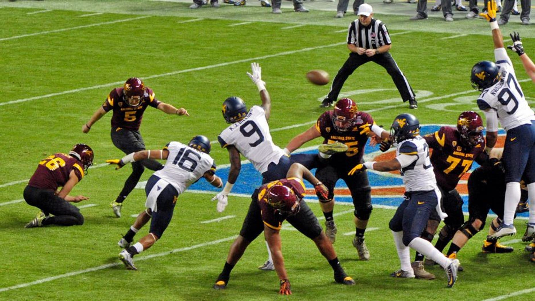 Jan 2, 2016; Phoenix, AZ, USA; Arizona State Sun Devils place kicker Zane Gonzalez (5) kicks a field goal during the first half against the West Virginia Mountaineers at Chase Field during the Cactus Bowl. Mandatory Credit: Matt Kartozian-USA TODAY Sports