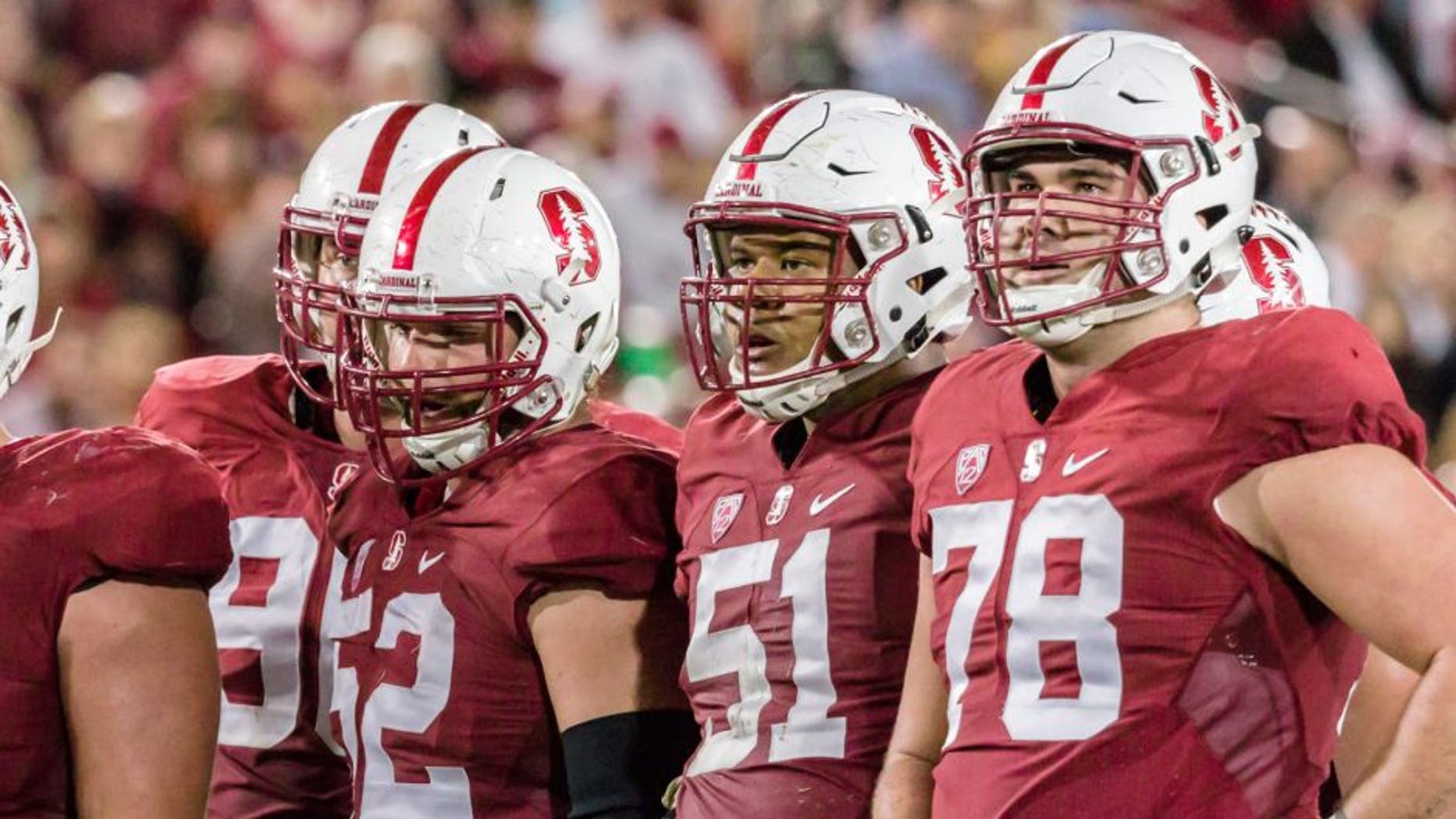 PALO ALTO, CA - OCTOBER 15: The Stanford Cardinal offense awaits the play call during a PAC-12 football game against the UCLA Bruins on October 15, 2015 at Stanford Stadium on the campus of Stanford University in Palo Alto, California. Visible players include Casey Tucker #77, Johnny Caspers #57, Graham Shuler #52, Joshua Garnett #51, and Kyle Murphy #78. (Photo by David Madison/Getty Images)