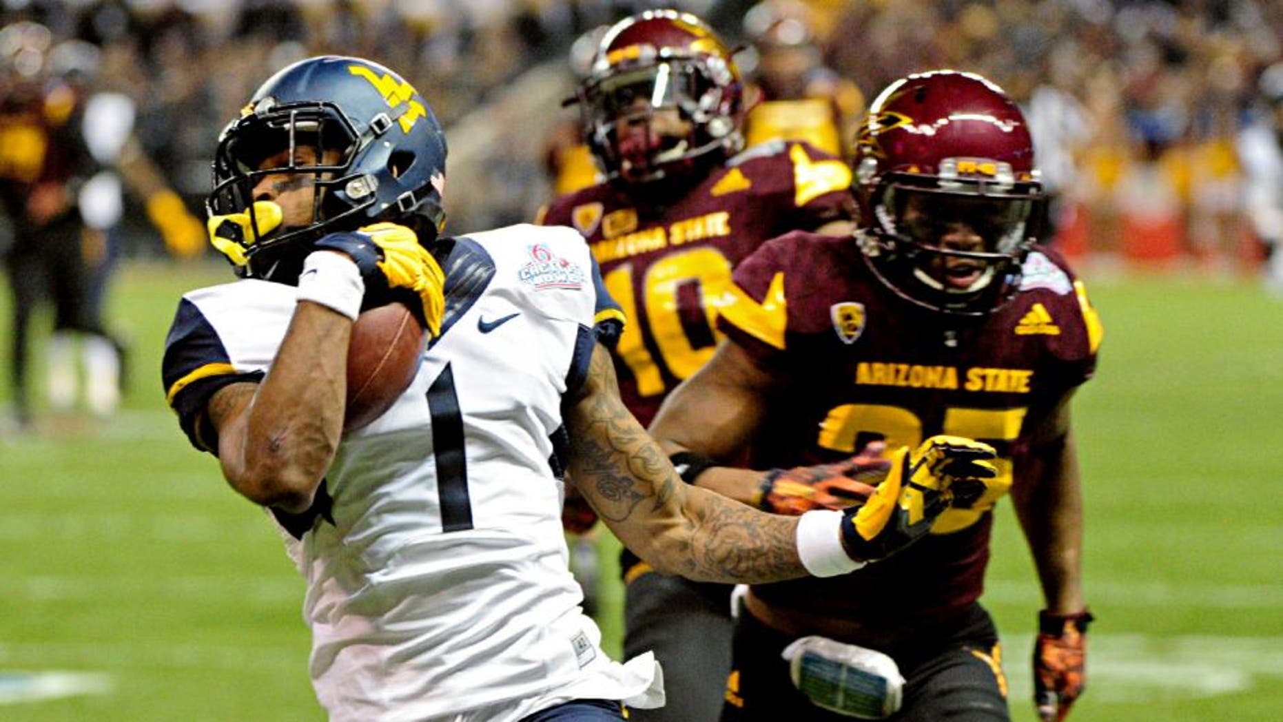 Jan 2, 2016; Phoenix, AZ, USA; West Virginia Mountaineers wide receiver Shelton Gibson (1) runs for a touchdown as Arizona State Sun Devils defensive back Kweishi Brown (10) and defensive back Kareem Orr (25) pursue during the first half at Chase Field during the Cactus Bowl. Mandatory Credit: Matt Kartozian-USA TODAY Sports