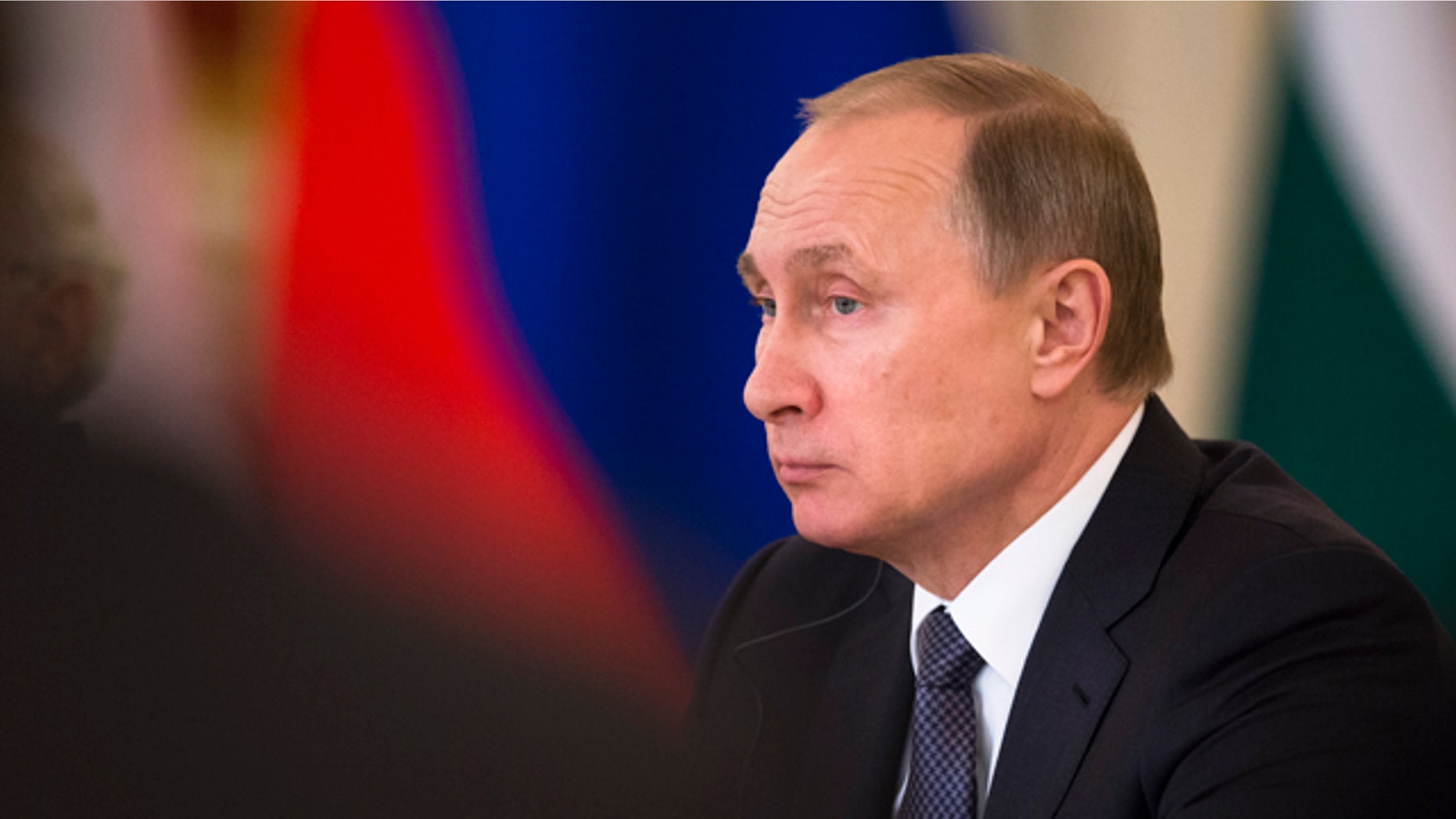 Russian President Vladimir Putin attends a meeting with Russian and Indian officials and businessmen during his meeting with Indian Prime Minister Narendra Modi in the Kremlin in Moscow, Thursday, Dec. 24, 2015. (AP Photo/Pavel Golovkin)