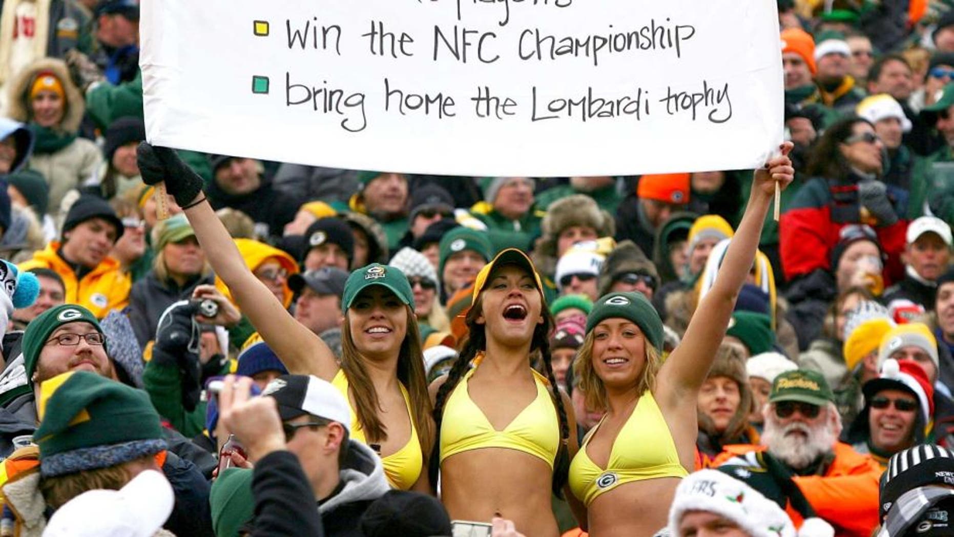 GREEN BAY, WI - DECEMBER 27: Fans of the Green Bay Packers hold a sign and wear bikini's in below freezing weather during a game between the Packers and the Seattle Seahawks at Lambeau Field on December 27, 2009 in Green Bay, Wisconsin. The Packers defeated the Seahawks 48-10. (Photo by Jonathan Daniel/Getty Images)