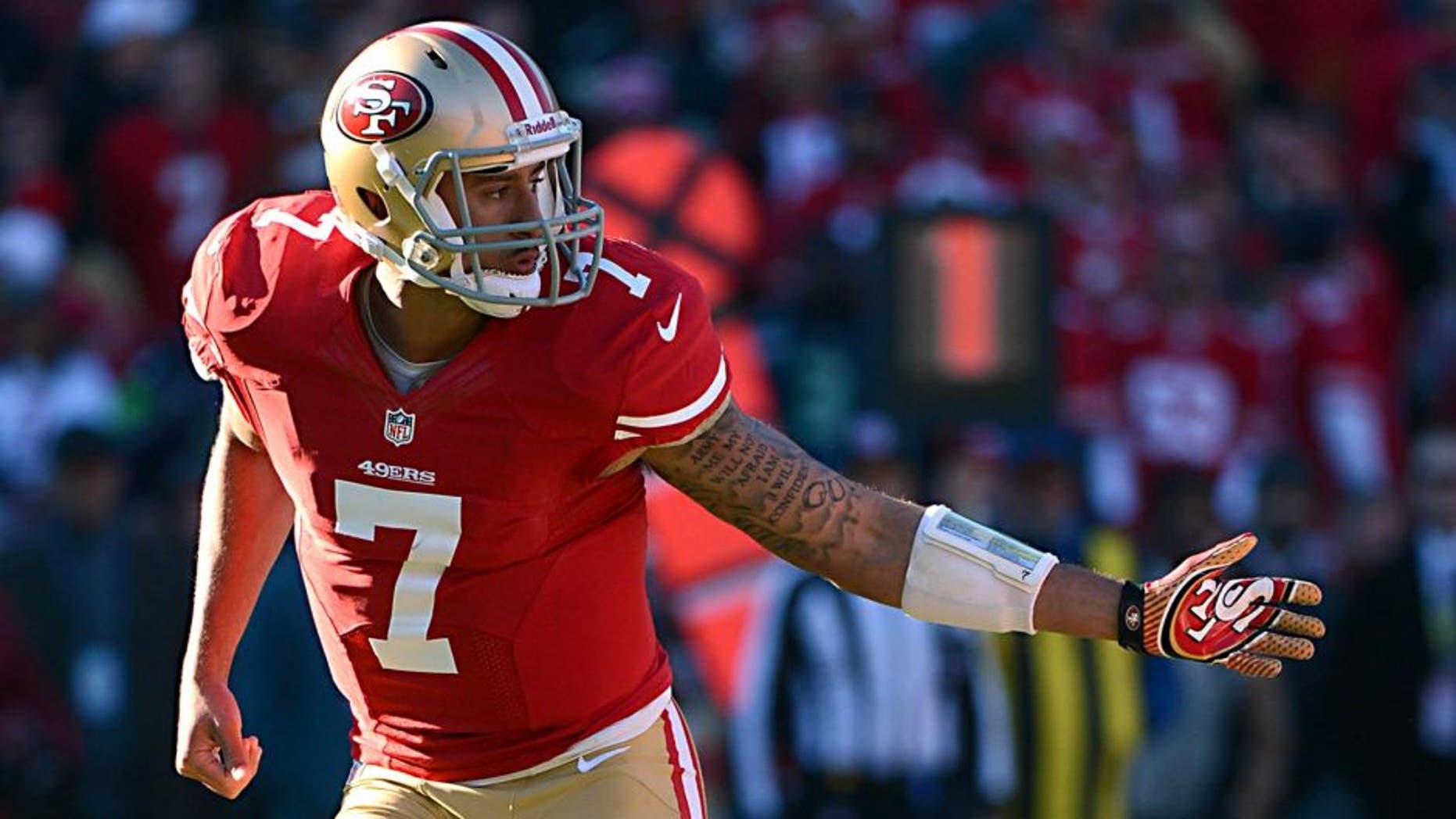 December 8, 2013; San Francisco, CA, USA; San Francisco 49ers quarterback Colin Kaepernick (7) follows through after handing the football off during the second quarter against the Seattle Seahawks at Candlestick Park. The 49ers defeated the Seahawks 19-17. Mandatory Credit: Kyle Terada-USA TODAY Sports