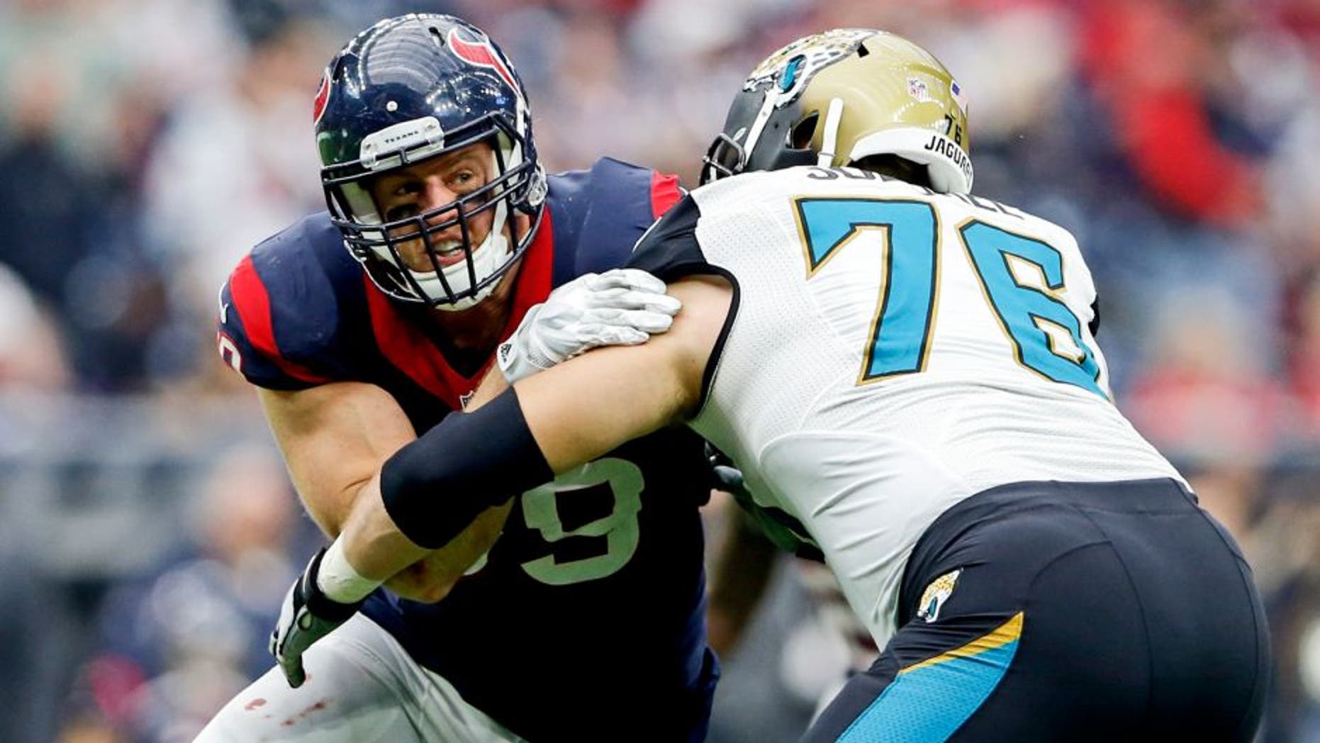 Jan 3, 2016; Houston, TX, USA; Houston Texans defensive end J.J. Watt (99) rushes against Jacksonville Jaguars tackle Luke Joeckel (76) during the game at NRG Stadium. Houston won 30-6. Mandatory Credit: Kevin Jairaj-USA TODAY Sports