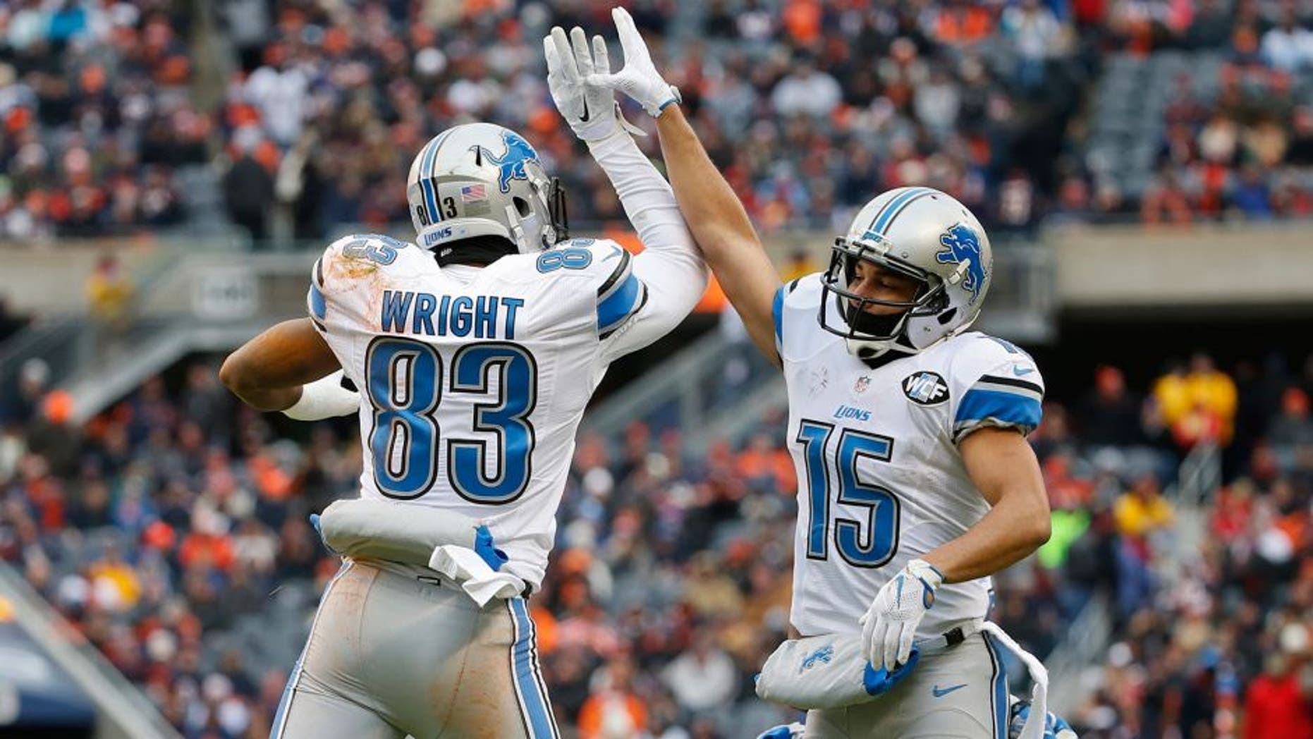 Jan 3, 2016; Chicago, IL, USA; Detroit Lions tight end Timothy Wright (83) celebrates with wide receiver Golden Tate (15) after scoring a touchdown against the Chicago Bears during the first half at Soldier Field. Mandatory Credit: Kamil Krzaczynski-USA TODAY Sports