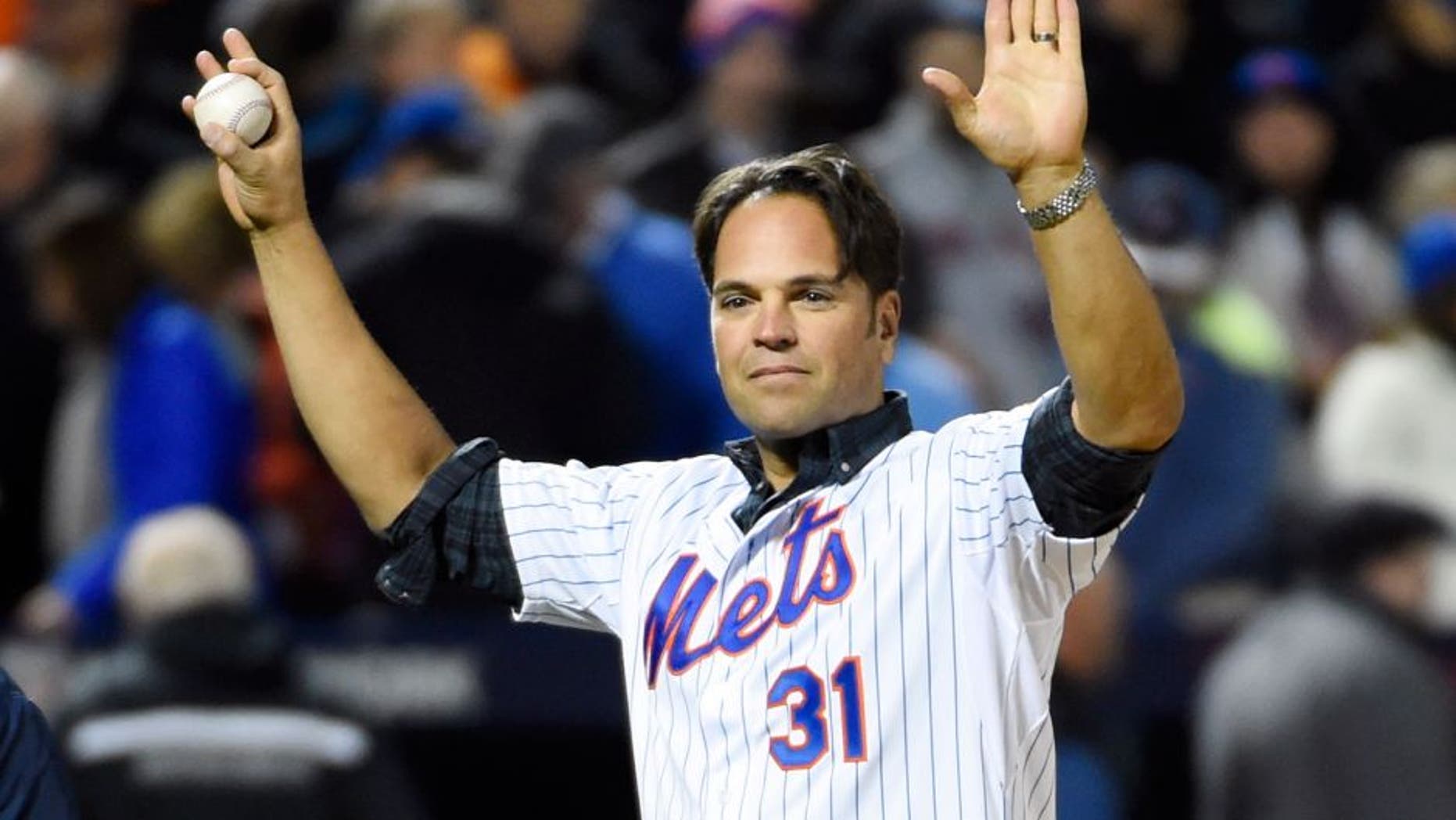 Oct 30, 2015; New York City, NY, USA; New York Mets former catcher Mike Piazza waves to the crowd before throwing the ceremonial first pitch before game three of the World Series against the Kansas City Royals at Citi Field. Mandatory Credit: Robert Deutsch-USA TODAY Sports