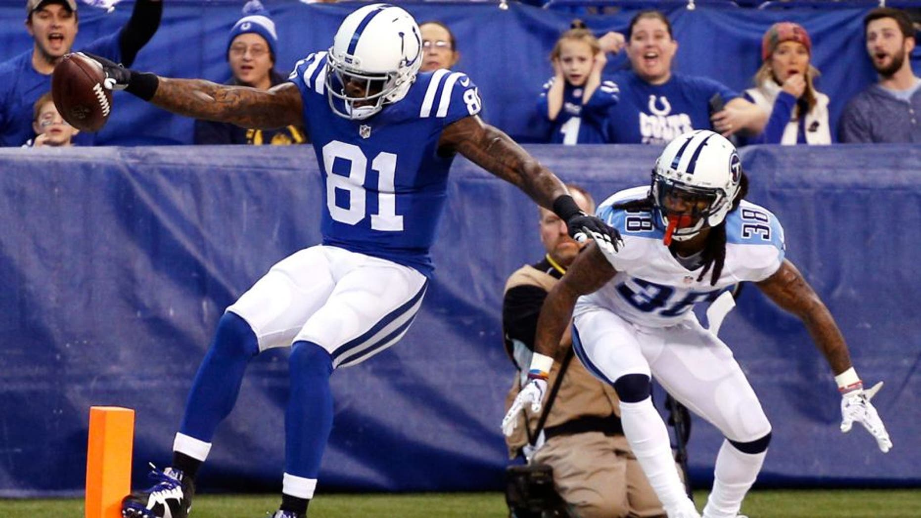 Jan 3, 2016; Indianapolis, IN, USA; Indianapolis Colts wide receiver Andre Johnson (81) catches a pass for a touchdown against Tennessee Titans cornerback B.W. Webb (38) at Lucas Oil Stadium. Mandatory Credit: Brian Spurlock-USA TODAY Sports
