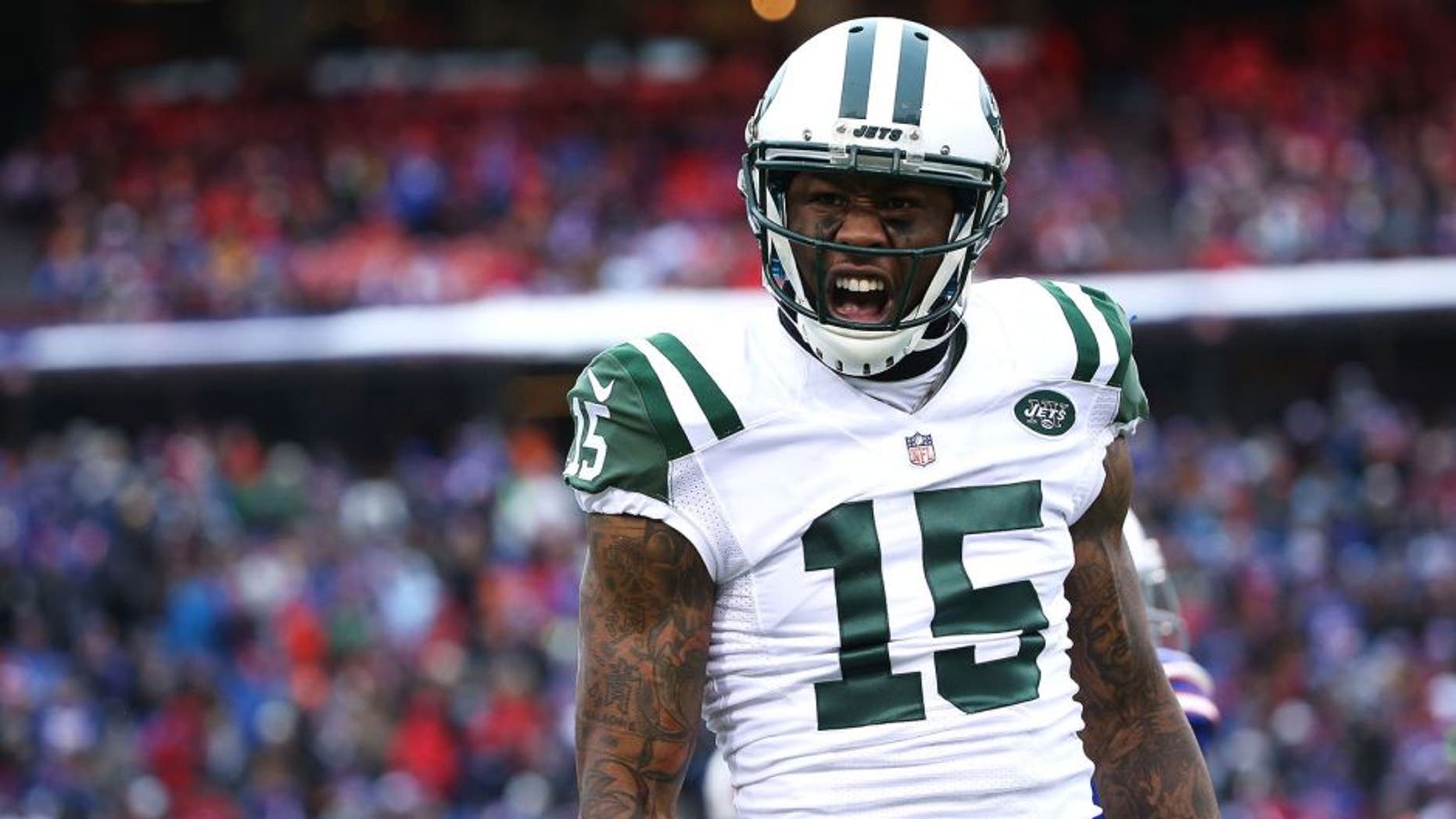 ORCHARD PARK, NY - JANUARY 03: Brandon Marshall #15 of the New York Jets celebrates a touchdown catch against the Buffalo Bills during the first half at Ralph Wilson Stadium on January 3, 2016 in Orchard Park, New York. (Photo by Tom Szczerbowski/Getty Images)