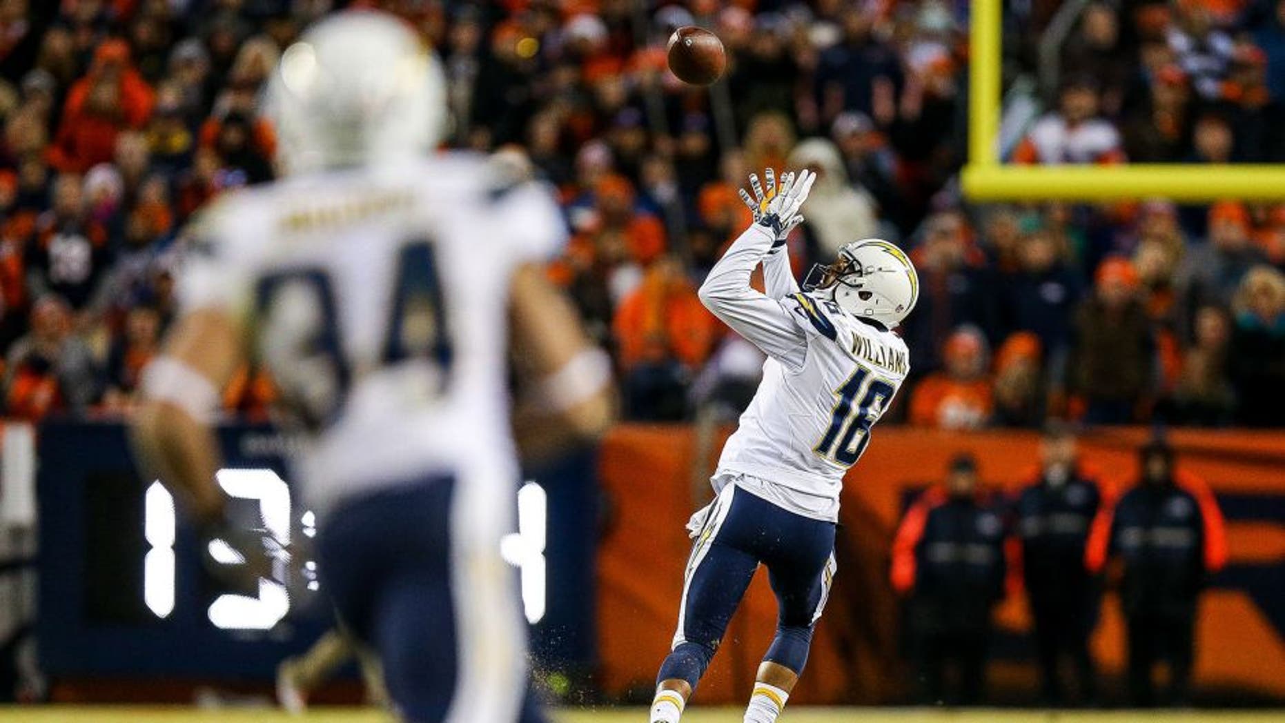 DENVER, CO - JANUARY 3: Wide receiver Tyrell Williams #16 of the San Diego Chargers catches a pass for an 80-yard touchdown against the Denver Broncos in the fourth quarter of a game at Sports Authority Field at Mile High on January 3, 2016 in Denver, Colorado. The catch was the first of Williams' NFL career. (Photo by Justin Edmonds/Getty Images)