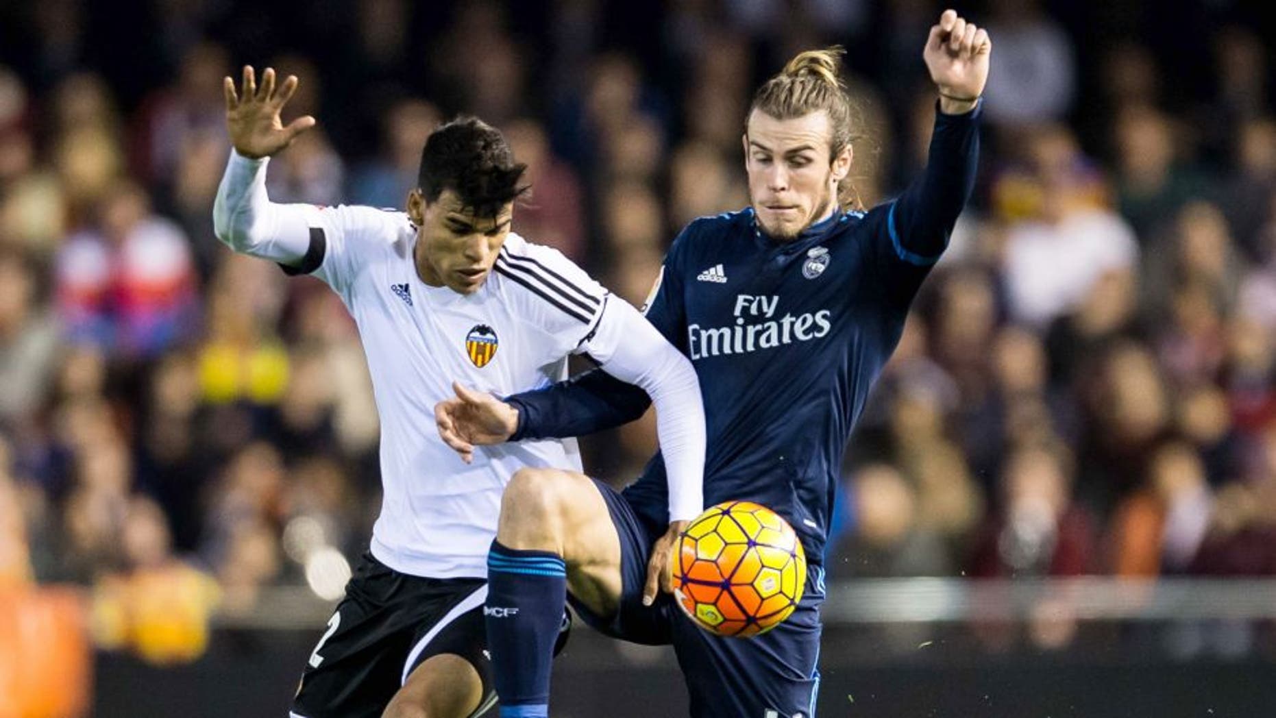 VALENCIA, SPAIN - JANUARY 03: Danilo of Valencia CF (L) competes for the ball with Gareth Bale of Real Madrid CF (R) during the Valencia CF vs Real Madrid CF as part of the Liga BBVA 2015-2016 at Estadi de Mestalla on January 3, 2016 in Valencia, Spain. (Photo by Aitor Colomer/Power Sport Images/Getty Images)