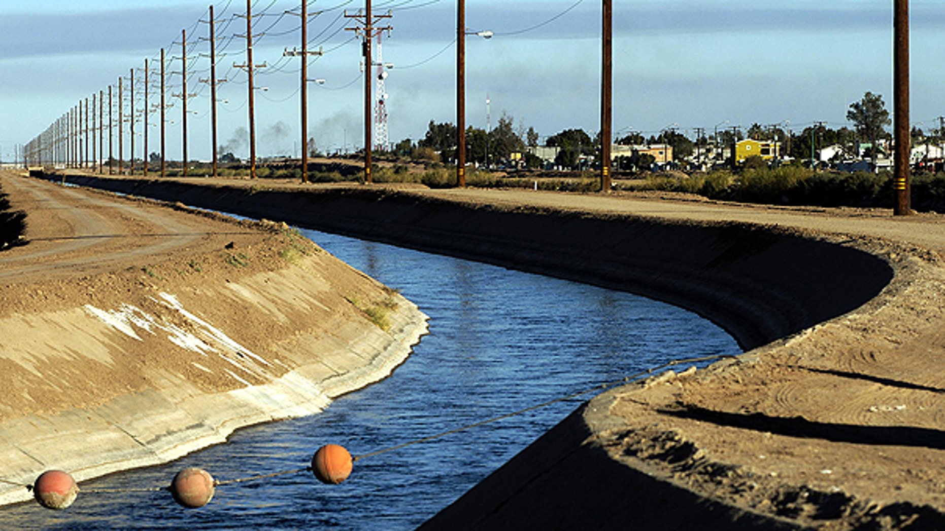 In this Dec. 30, 2002 file photo, the All-American Canal runs along the United States border with Mexico near Calexico, Calif.