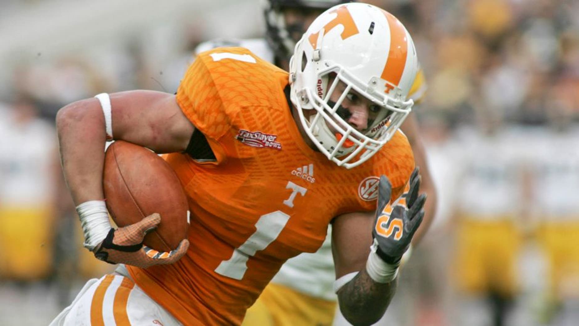 Jan 2, 2015; Jacksonville, FL, USA; Tennessee Volunteers running back Jalen Hurd (1) runs for a 29-yard touchdown in the first quarter of their 2015 TaxSlayer Bowl against the Iowa Hawkeyes at EverBank Field. Mandatory Credit: Phil Sears-USA TODAY Sports