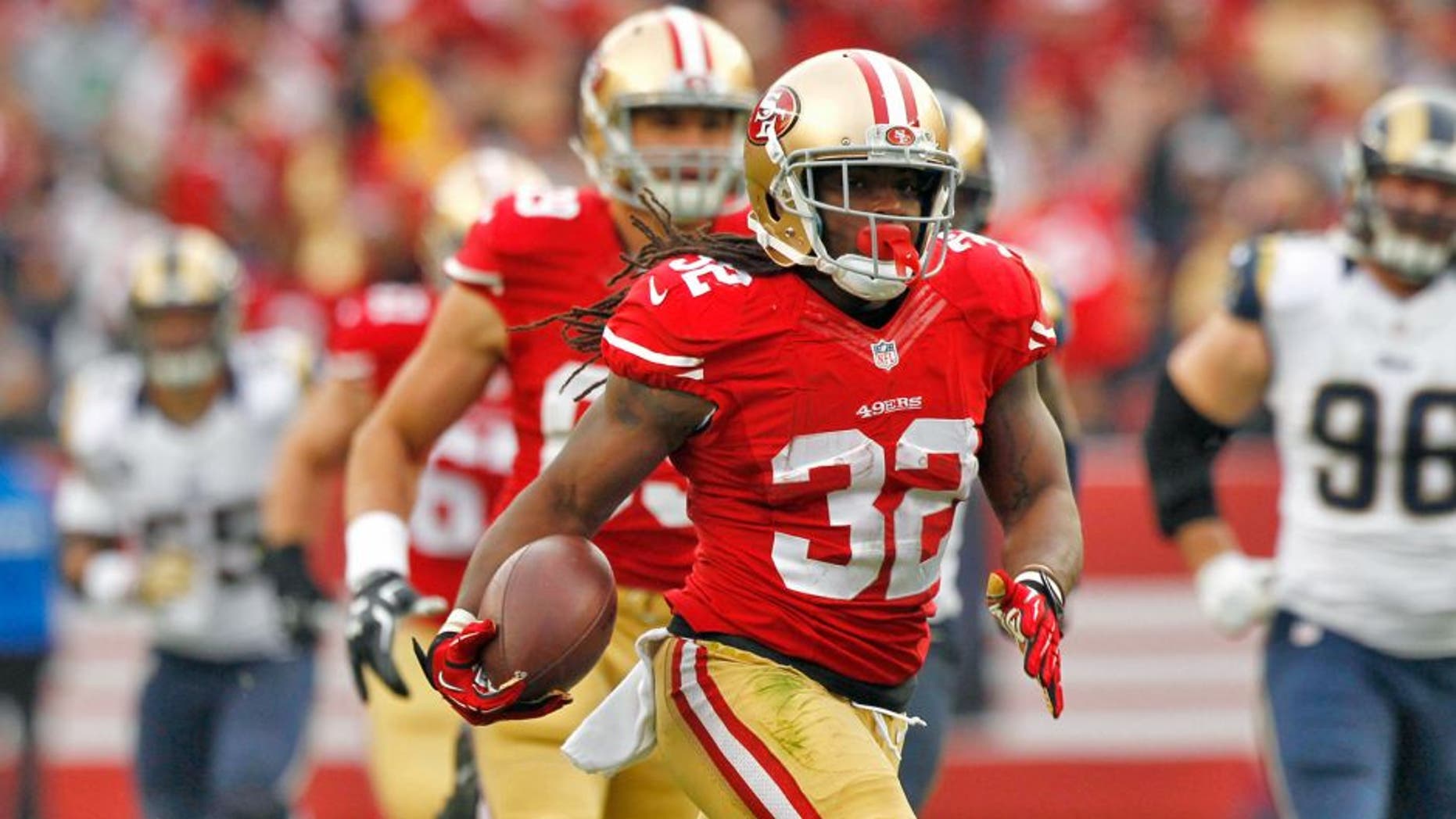 Jan 3, 2016; Santa Clara, CA, USA; San Francisco 49ers running back DuJuan Harris (32) carries the ball against the St. Louis Rams in the second quarter at Levi's Stadium. Mandatory Credit: Cary Edmondson-USA TODAY Sports
