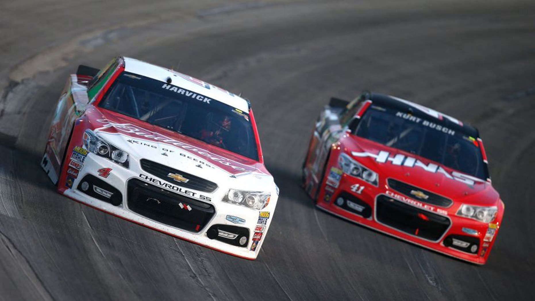 SPARTA, KY - JULY 11: Kevin Harvick, driver of the #4 Budweiser/Jimmy John's Chevrolet, and Kurt Busch, driver of the #41 Haas Automation Chevrolet, race during the NASCAR Sprint Cup Series Quaker State 400 presented by Advance Auto Parts at Kentucky Speedway on July 11, 2015 in Sparta, Kentucky. (Photo by Todd Warshaw/Getty Images)