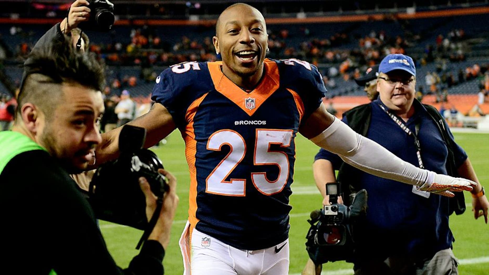 Nov 1, 2015; Denver, CO, USA; Denver Broncos cornerback Chris Harris (25) reacts following the win over the Green Bay Packers at Sports Authority Field at Mile High. The Broncos defeated the Packer 29-10. Mandatory Credit: Ron Chenoy-USA TODAY Sports
