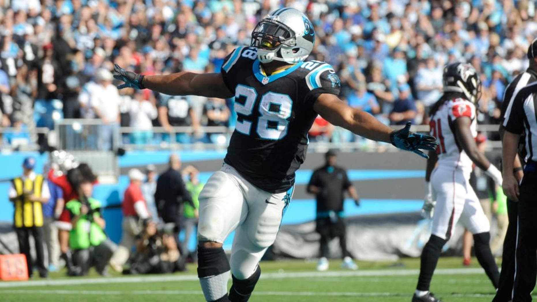 Dec 13, 2015; Charlotte, NC, USA; Carolina Panthers running back Jonathan Stewart (28) celebrates after scoring a touchdown during the first half of the game against the Atlanta Falcons at Bank of America Stadium. Mandatory Credit: Sam Sharpe-USA TODAY Sports