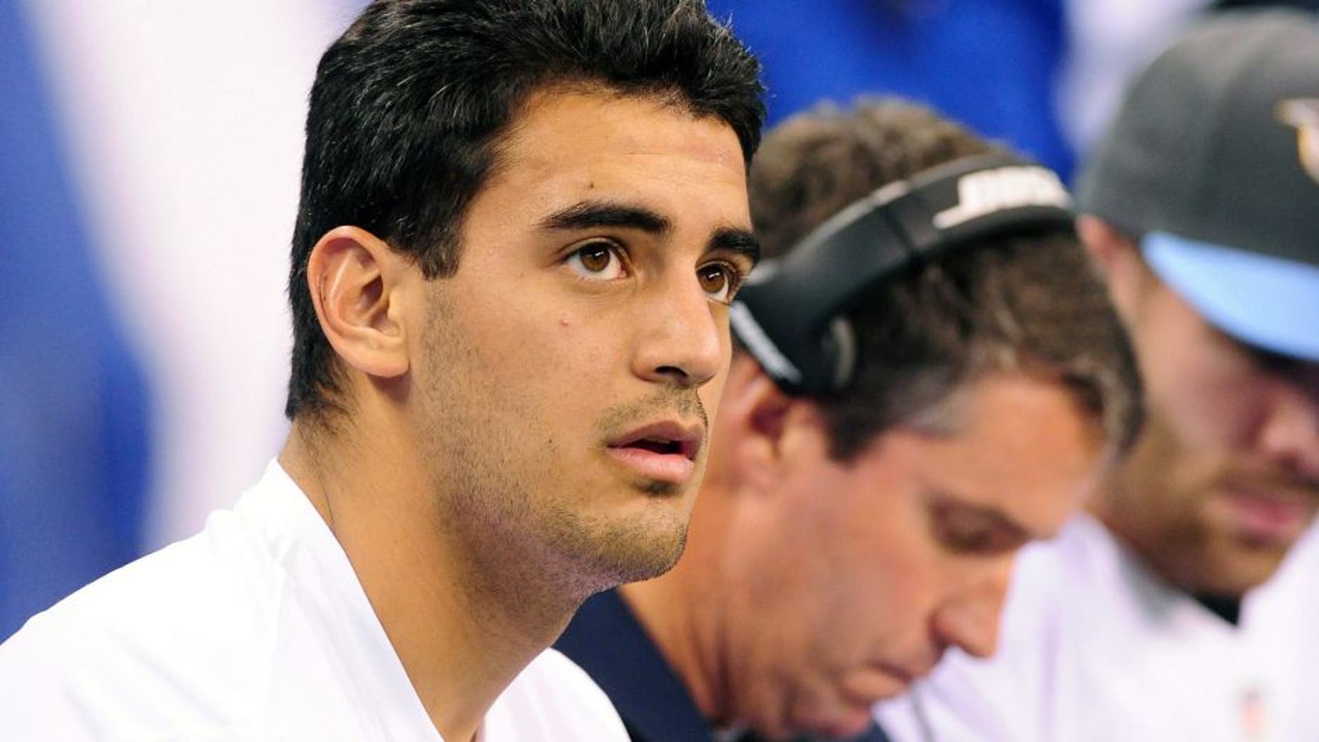 Jan 3, 2016; Indianapolis, IN, USA; Tennessee Titans quarterback Marcus Mariota (8) watches from the sidelines against the Indianapolis Colts at Lucas Oil Stadium. Mandatory Credit: Thomas J. Russo-