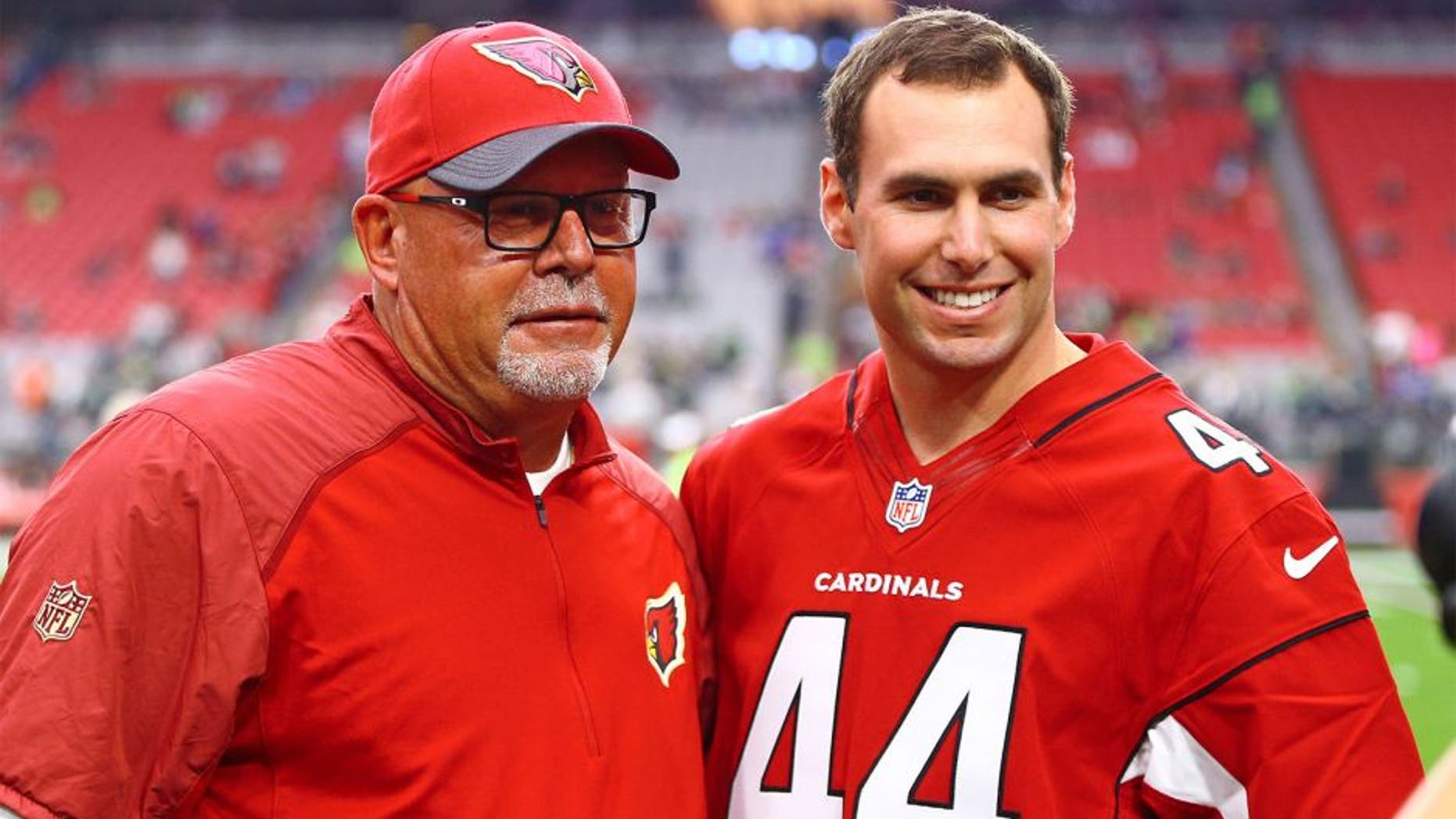 Jan 3, 2016; Glendale, AZ, USA; Arizona Diamondbacks first baseman Paul Goldschmidt (right) with Arizona Cardinals head coach Bruce Arians prior to the game against the Seattle Seahawks at University of Phoenix Stadium. Mandatory Credit: Mark J. Rebilas-USA TODAY Sports