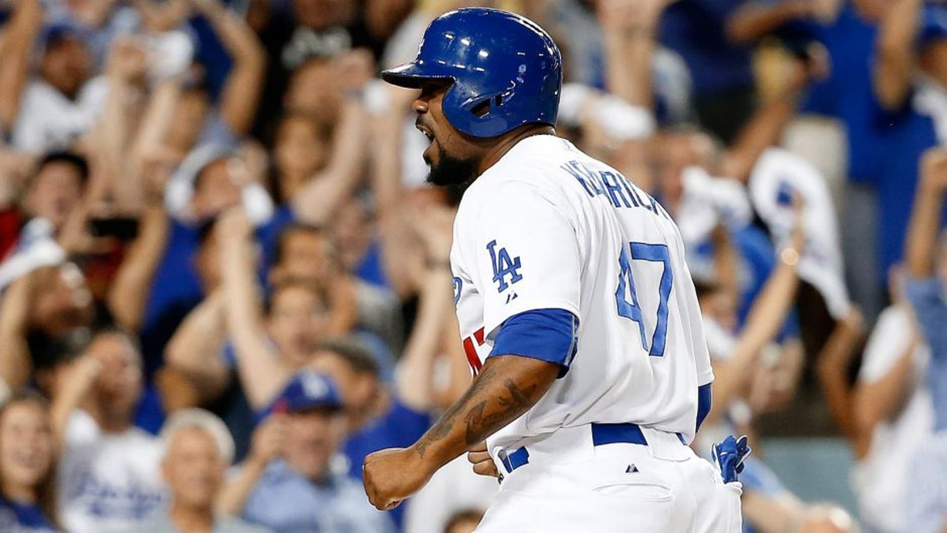 LOS ANGELES, CA - OCTOBER 10: Howie Kendrick #47 of the Los Angeles Dodgers celebrates after he slides home safely to score on a two-RBI double by Adrian Gonzalez #23 of the Los Angeles Dodgers in the seventh inning against the New York Mets in game two of the National League Division Series at Dodger Stadium on October 10, 2015 in Los Angeles, California. (Photo by Sean M. Haffey/Getty Images)