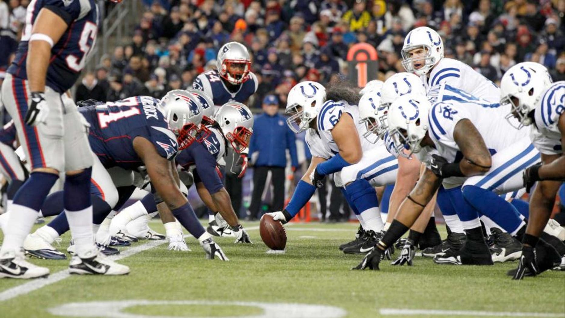 Nov 18, 2012; Foxborough, MA, USA; Indianapolis Colts quarterback Andrew Luck (12) at the line of scrimmage against the New England Patriots during the first half at Gillette Stadium. The Patriots defeated the Indianapolis Colts 59-24. Mandatory Credit: David Butler II-USA TODAY Sports