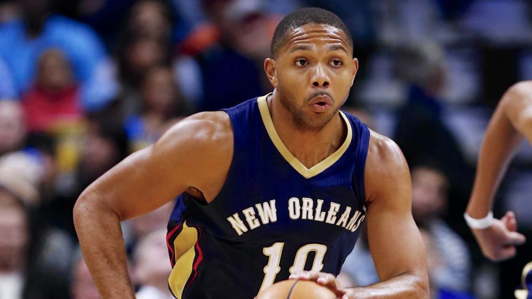 Nov 21, 2014; Denver, CO, USA; New Orleans Pelicans guard Eric Gordon (10) dribbles the ball up court in the third quarter against the Denver Nuggets at Pepsi Center. The Nuggets won 117-97. Mandatory Credit: Isaiah J. Downing-USA TODAY Sports
